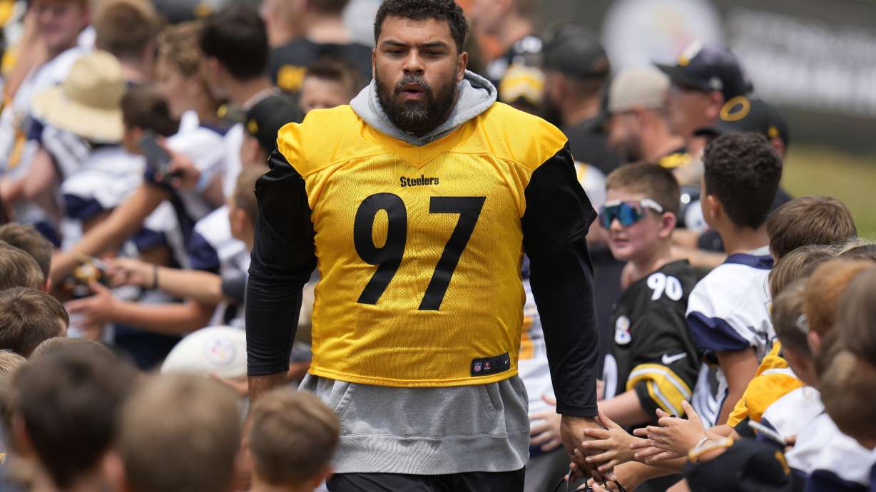 FILE - Pittsburgh Steelers defensive tackle Cameron Heyward arrives for the NFL football team's training camp workout in Latrobe, Pa., July 27, 2023. Heyward said Thursday, July 25, 2024 he wants to retire with the Steelers. The 35-year-old defensive tackle also understands it's likely not his call.
