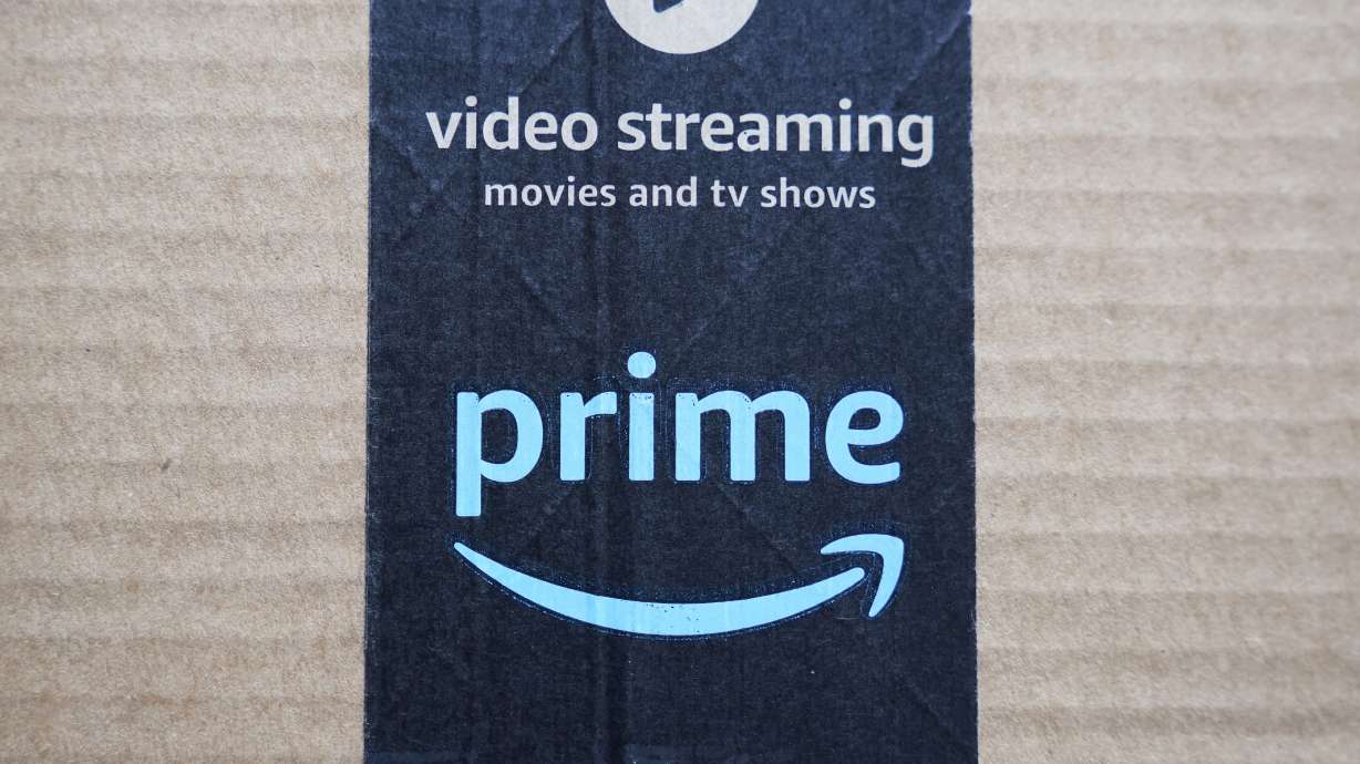 FILE - An Amazon Prime cardboard shipping box label is seen on March 17, 2023, in East Derry, N.H. Amazon Prime Day is here. And experts are reminding consumers to be wary of scams.