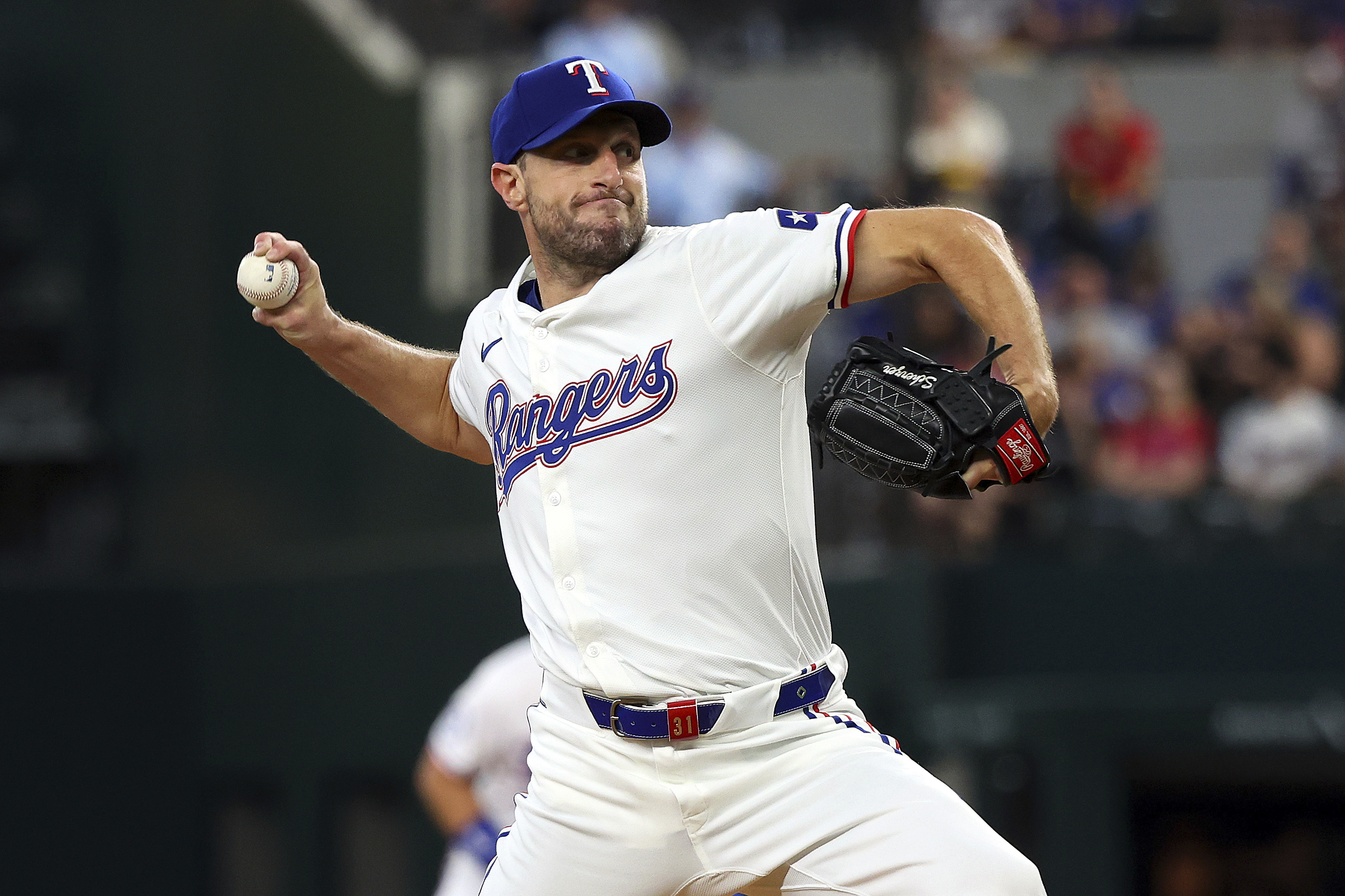 Texas Rangers starting pitcher Max Scherzer (31) delivers in the first inning of a baseball game against the Chicago White Sox Thursday, July 25, 2024, in Arlington, Texas. 