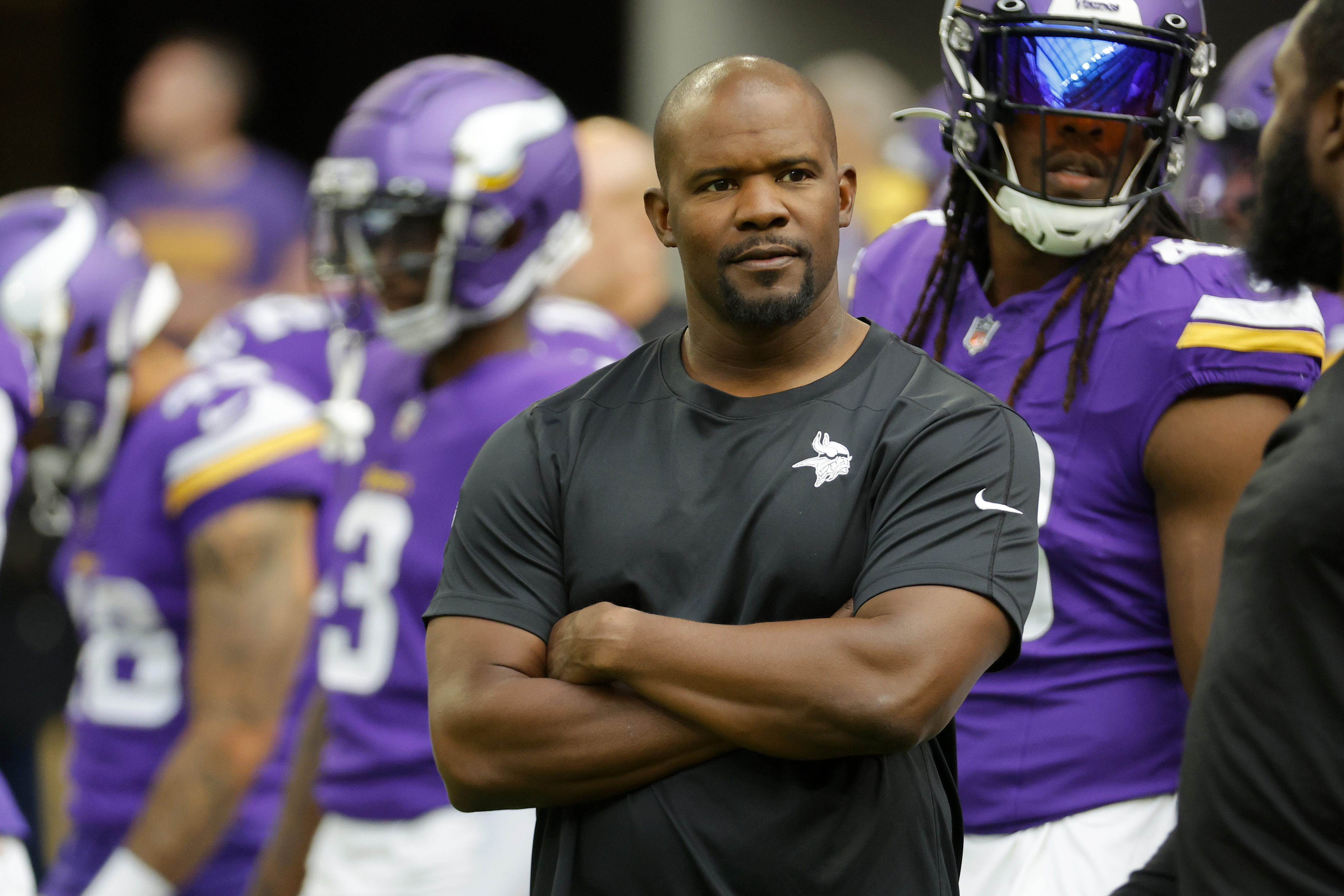 FILE - Minnesota Vikings defensive coordinator Brian Flores watches his players prior to an NFL preseason football game against the Arizona Cardinals, Aug. 26, 2023, in Minneapolis. Flores still has a pit in his stomach when he thinks about the Khyree Jackson and the car crash that took the rookie cornerbacks' life earlier this month. The Vikings defensive coordinator was not only enamored by Jackson's potential but by the unconventional path he took to the NFL.