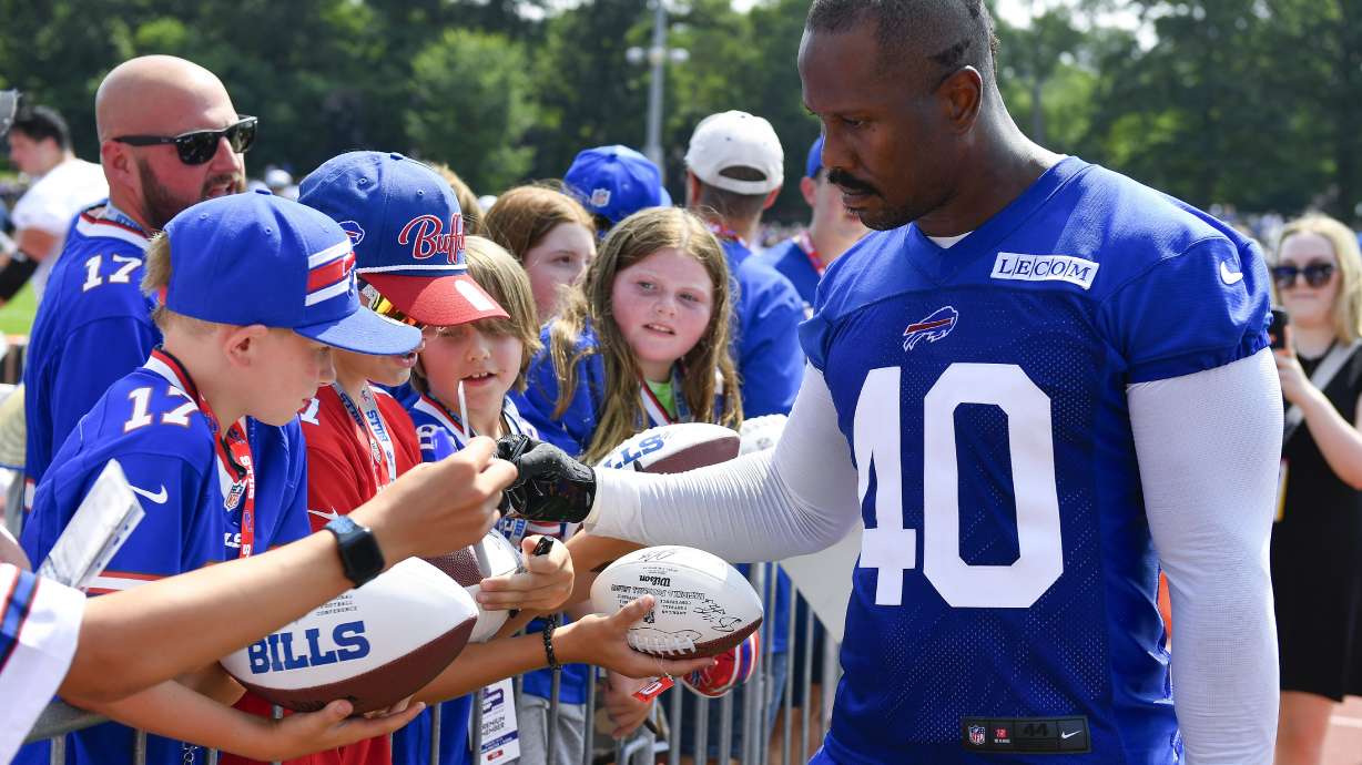 Buffalo Bills linebacker Von Miller (40) signs autographs after an NFL football training camp practice in Pittsford, N.Y., Wednesday, July 24, 2024.