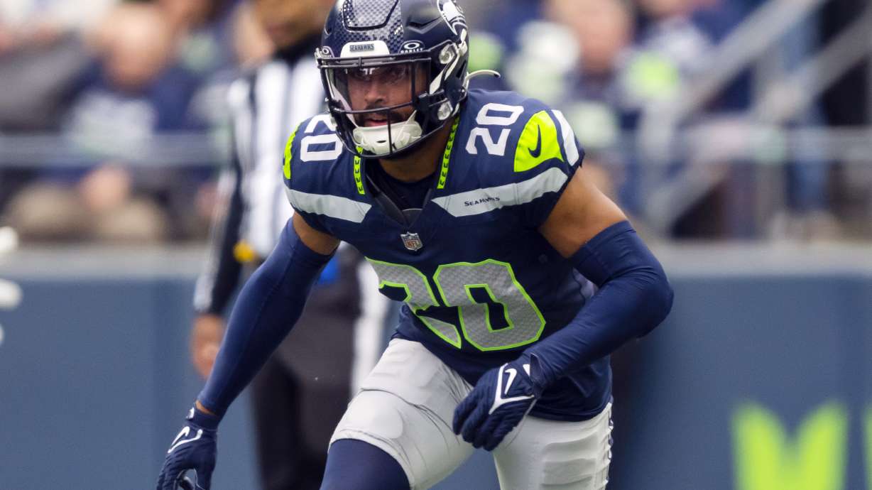 FILE - Seattle Seahawks safety Julian Love (20) runs during an NFL football game against the Arizona Cardinals, Sunday, Oct. 22, 2023 in Seattle. The Seahawks and Love have reached agreement on a three-year extension that could be worth up to $36 million.