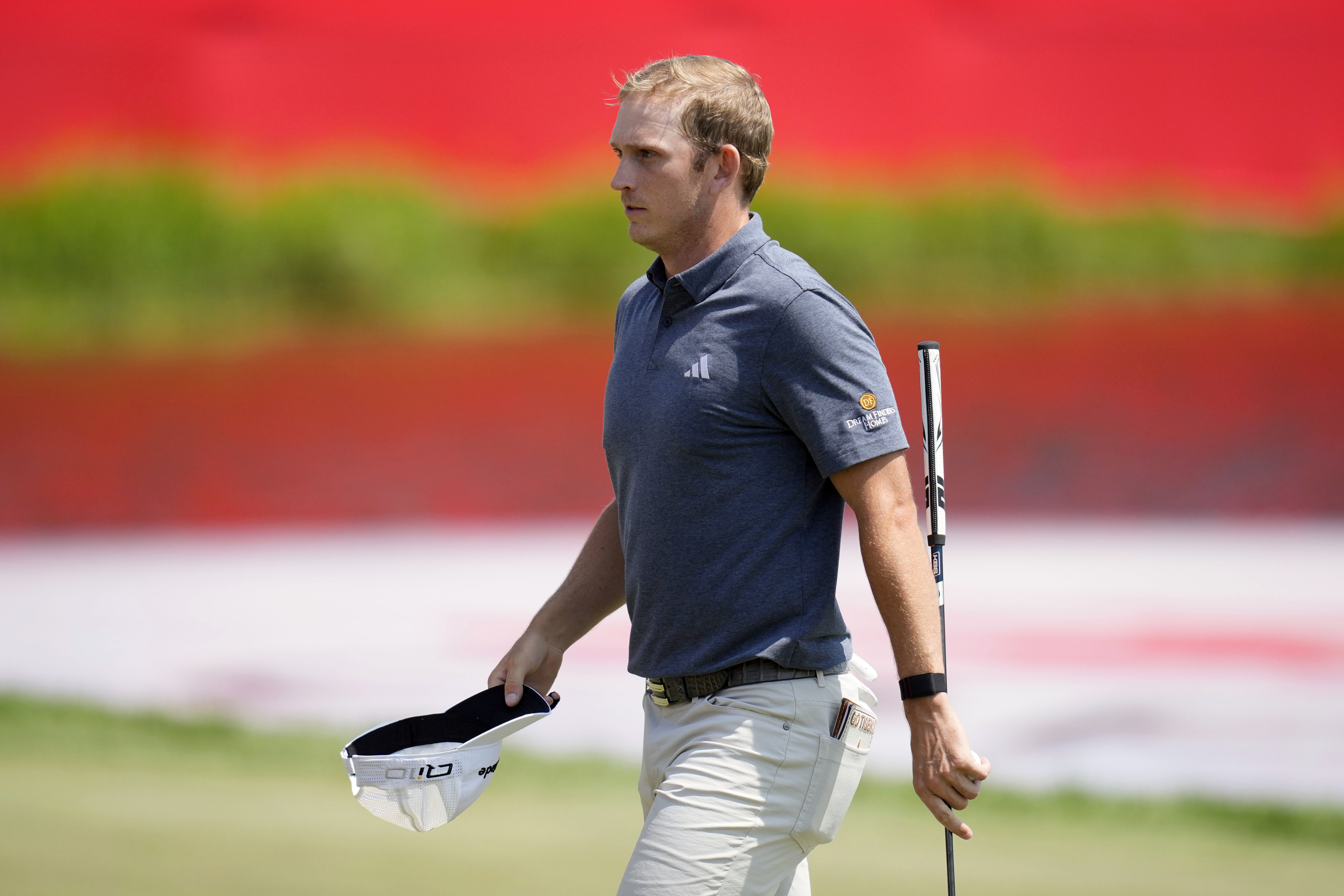 Jacob Bridgeman walks on the 18th green after making a birdie putt during the first round of the 3M Open golf tournament at the Tournament Players Club, Thursday, July 25, 2024, in Blaine, Minn.