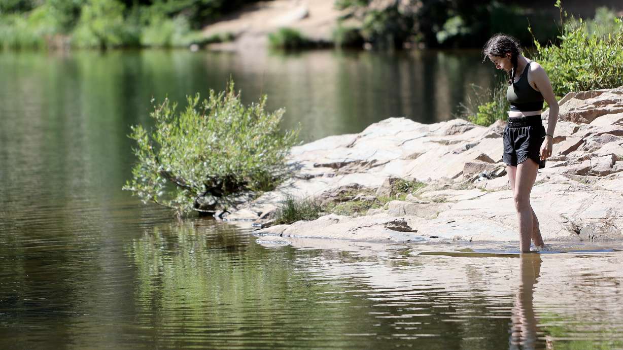 Quinn Mitchell wades in Bloods Lake in Wasatch County on Thursday. Exposure to nature has positive mental health impacts, research shows.
