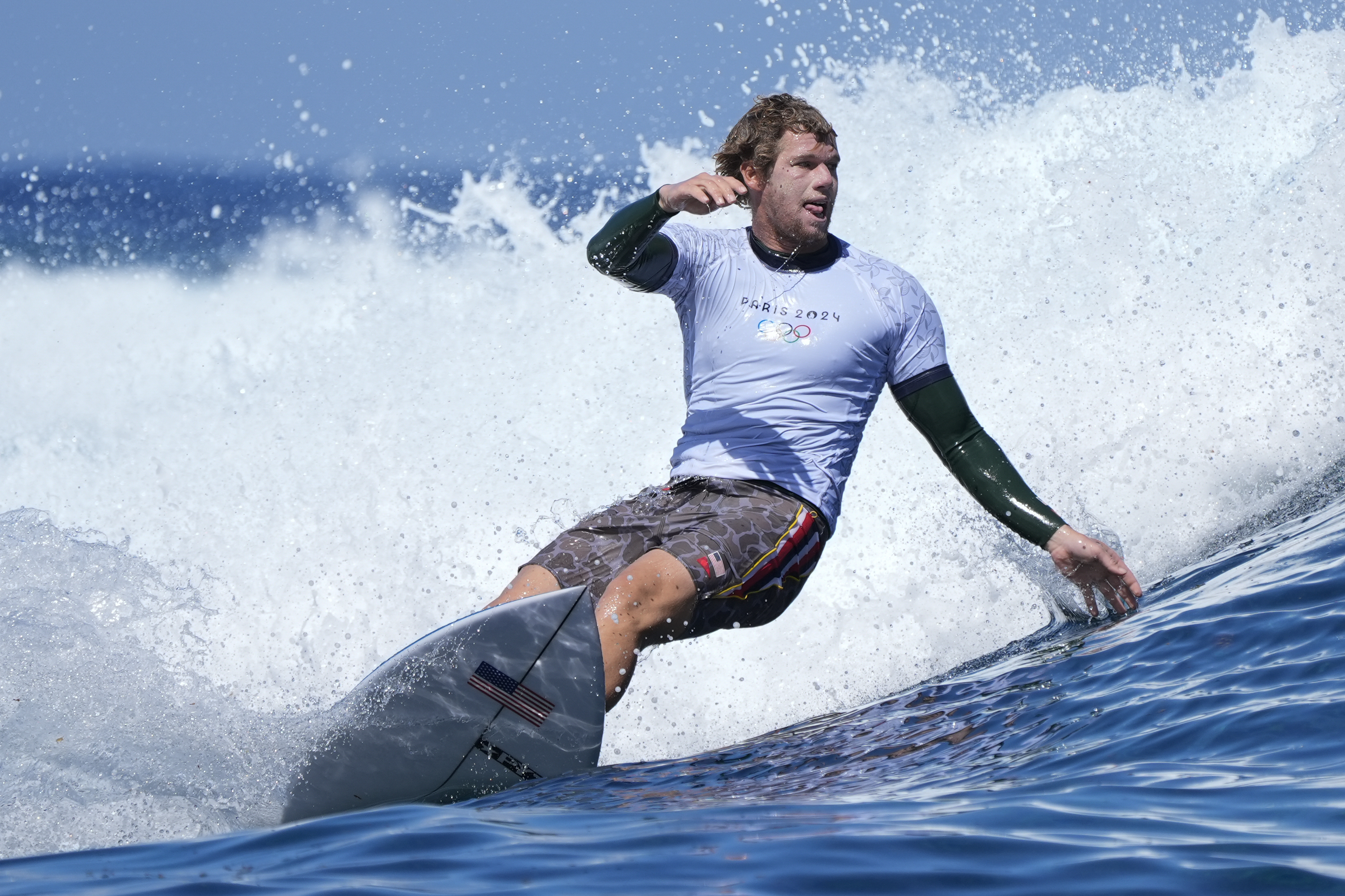 John John Florence, of the United States, surfs on a training day ahead of the 2024 Summer Olympics surfing competition Thursday, July 25, 2024, in Teahupo'o, Tahiti. 