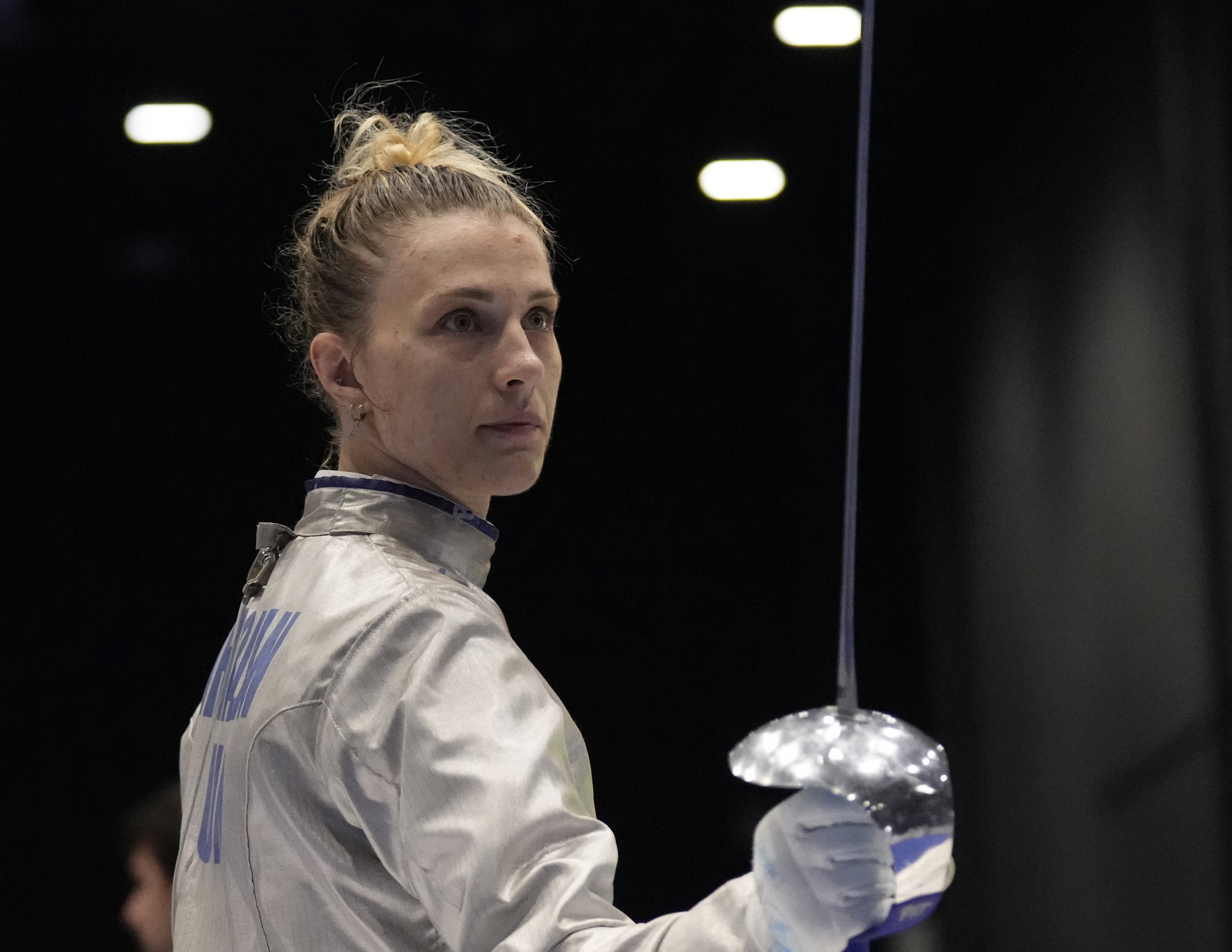 FILE - Olga Kharlan, of Ukraine, stands during the women's team sabre event against Uzbekistan at the Fencing World Championships in Milan, Italy, July 29, 2023. For Ukrainian competitors in Paris for the Olympics, joy goes hand in hand with sorrow. Athletes are striving to enjoy the dream of competing at one of the world’s most prestigious sports events while carrying the burden of the war back home.