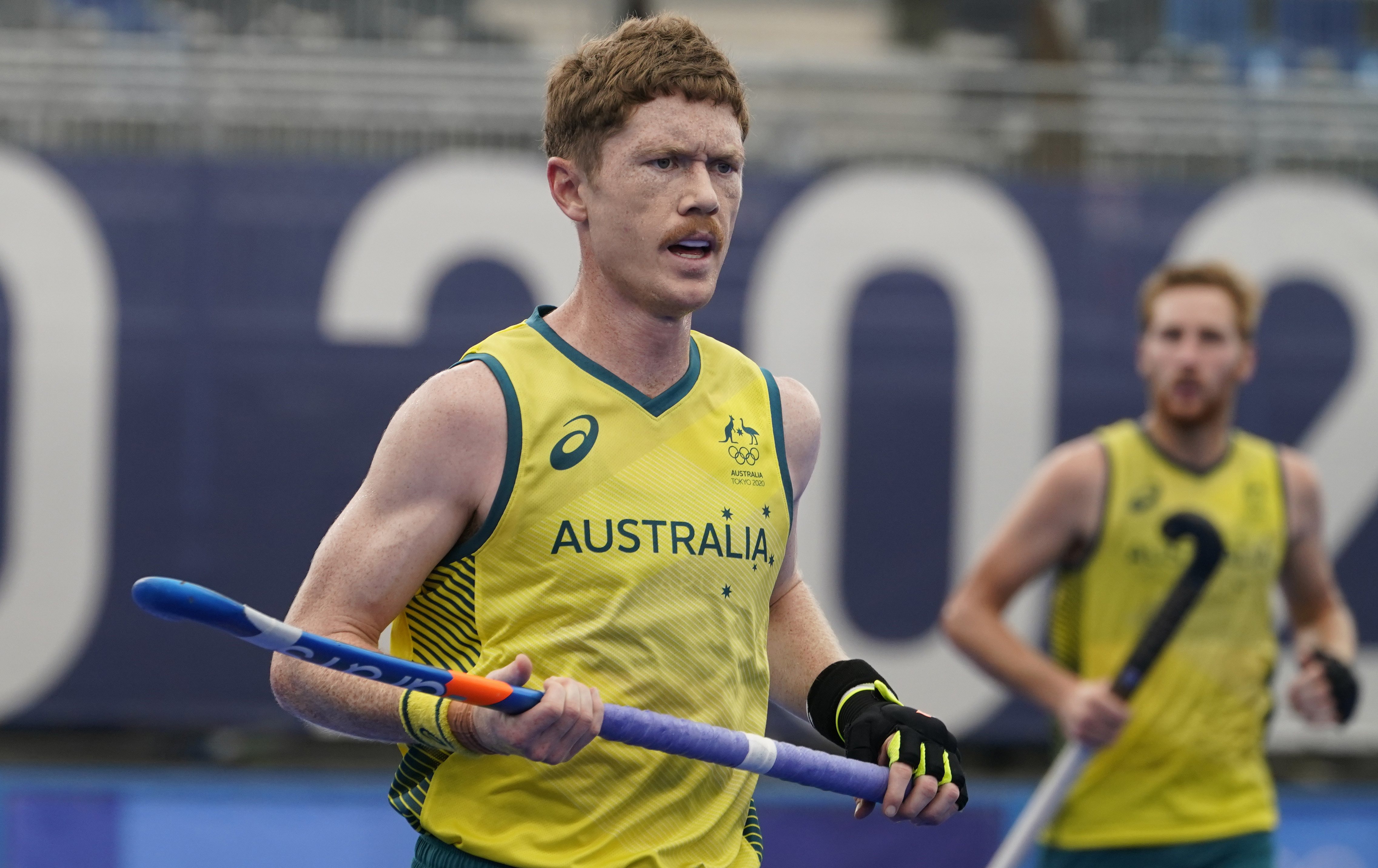 FILE - Australia's Matthew Dawson runs the pitch during a men's field hockey match against Spain at the 2020 Summer Olympics, Friday, July 30, 2021, in Tokyo, Japan. Dawson was so determined to compete in the Paris Olympics that he had part of the ring finger on his right hand amputated. Dawson severely injured the finger in practice two weeks ago. Surgery would have required months of recovery time and jeopardized his likelihood of playing in the tournament. 