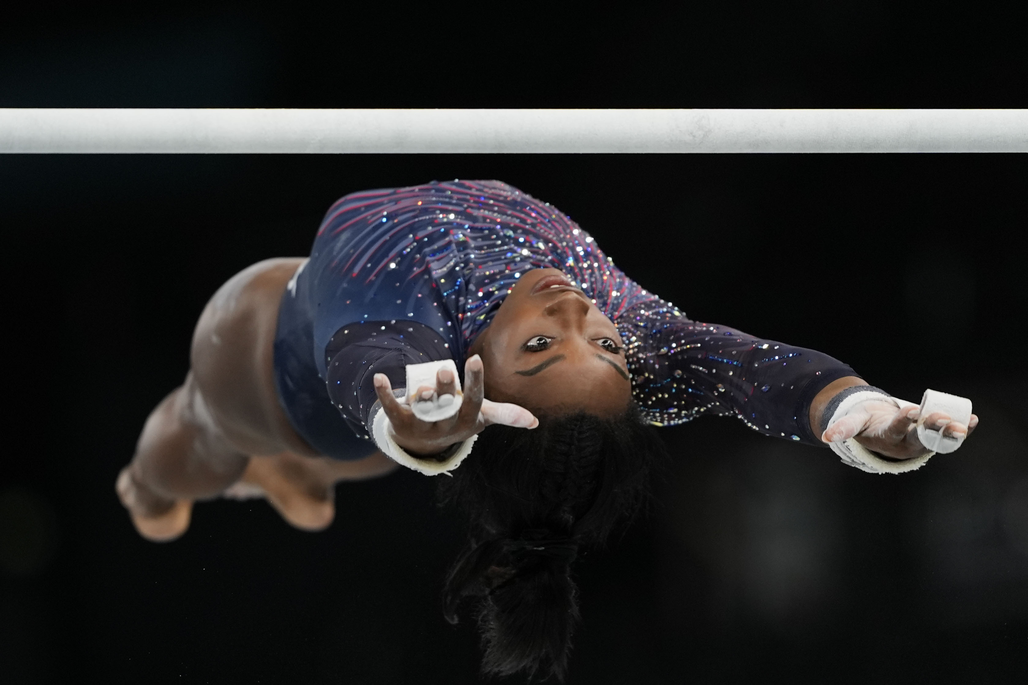 Simone Biles of the United States practices the uneven bars during a gymnastics training session at Bercy Arena at the 2024 Summer Olympics, Thursday, July 25, 2024, in Paris, France. 