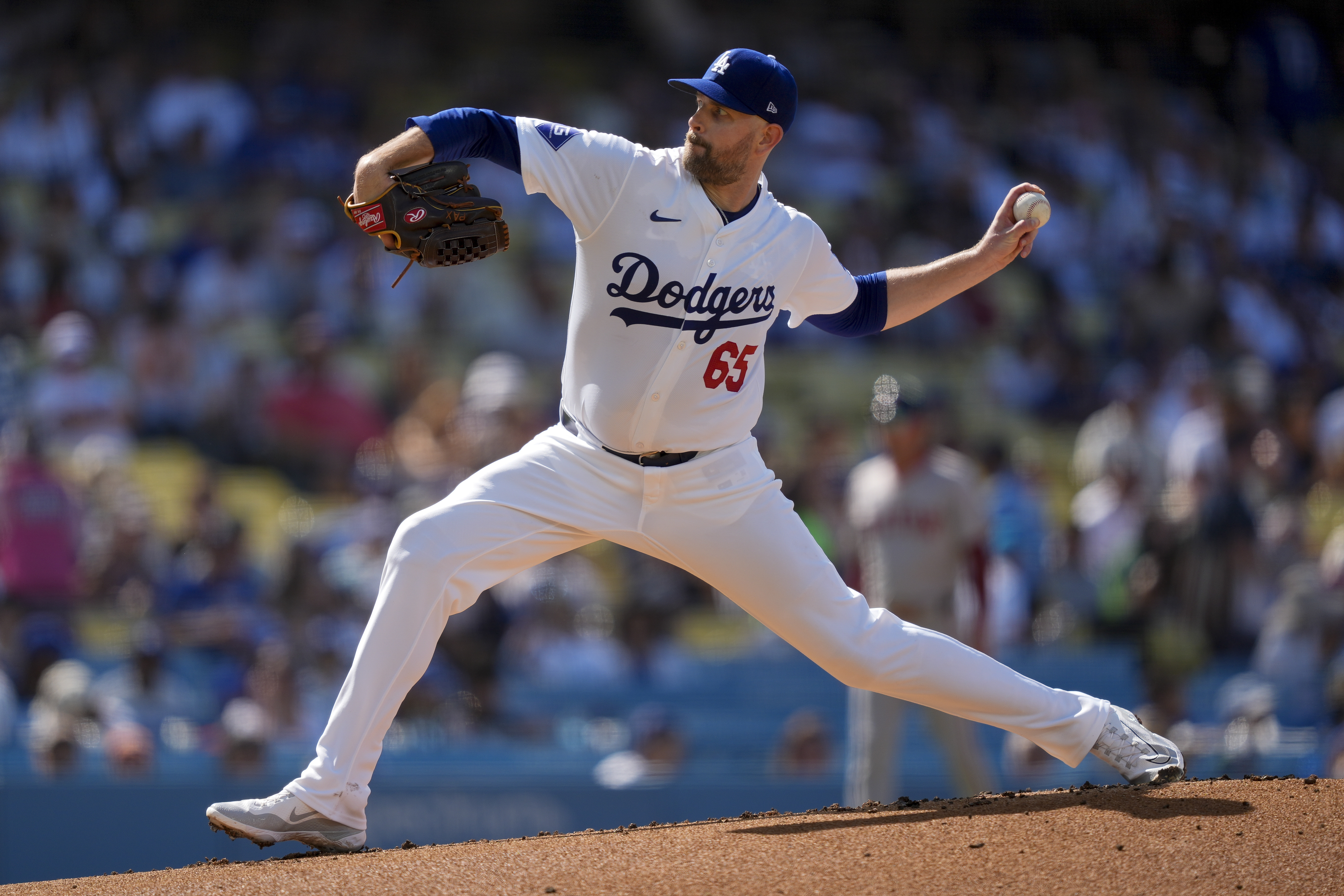 Los Angeles Dodgers starting pitcher James Paxton throws during the first inning of a baseball game against the Boston Red Sox, Sunday, July 21, 2024, in Los Angeles.