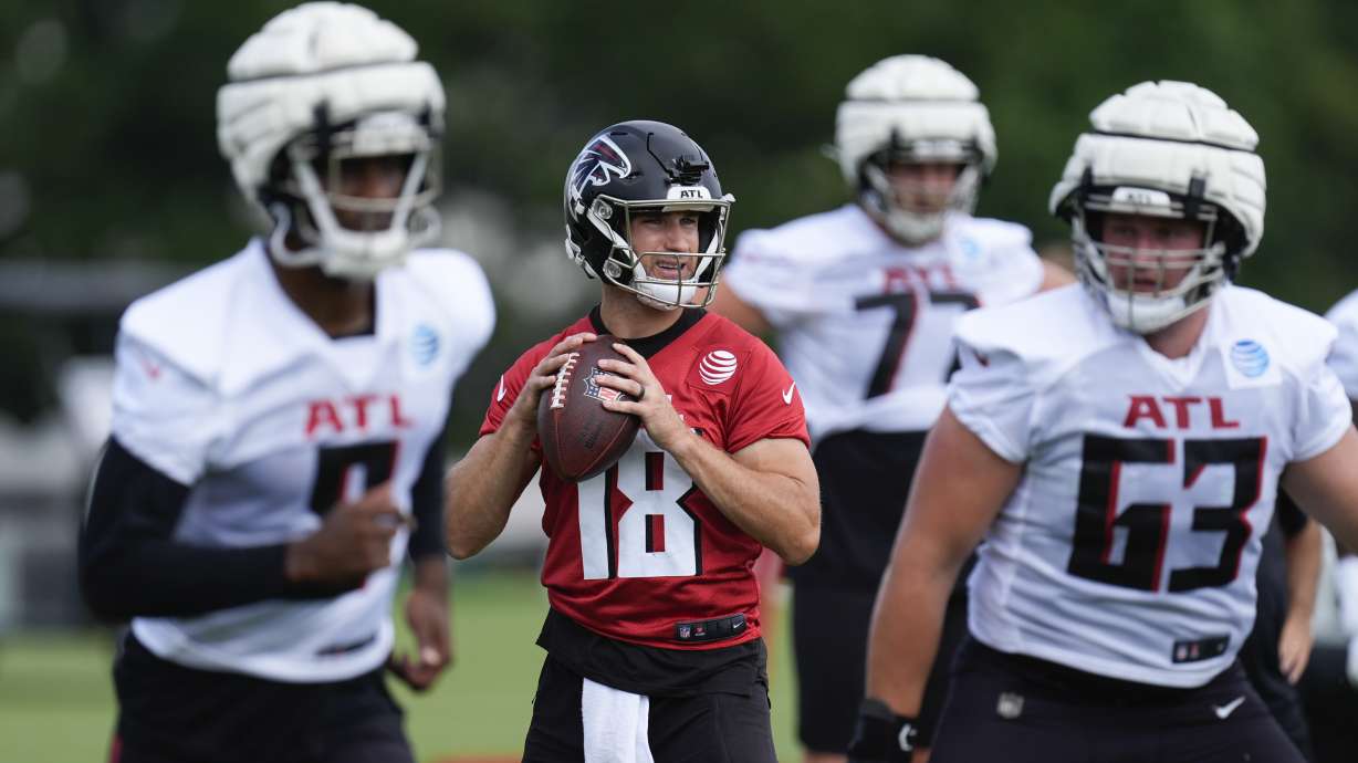 Atlanta Falcons quarterback Kirk Cousins (18) throws a pass during an NFL training camp football practice Friday, July 26, 2024, in Flowery Branch, Ga.