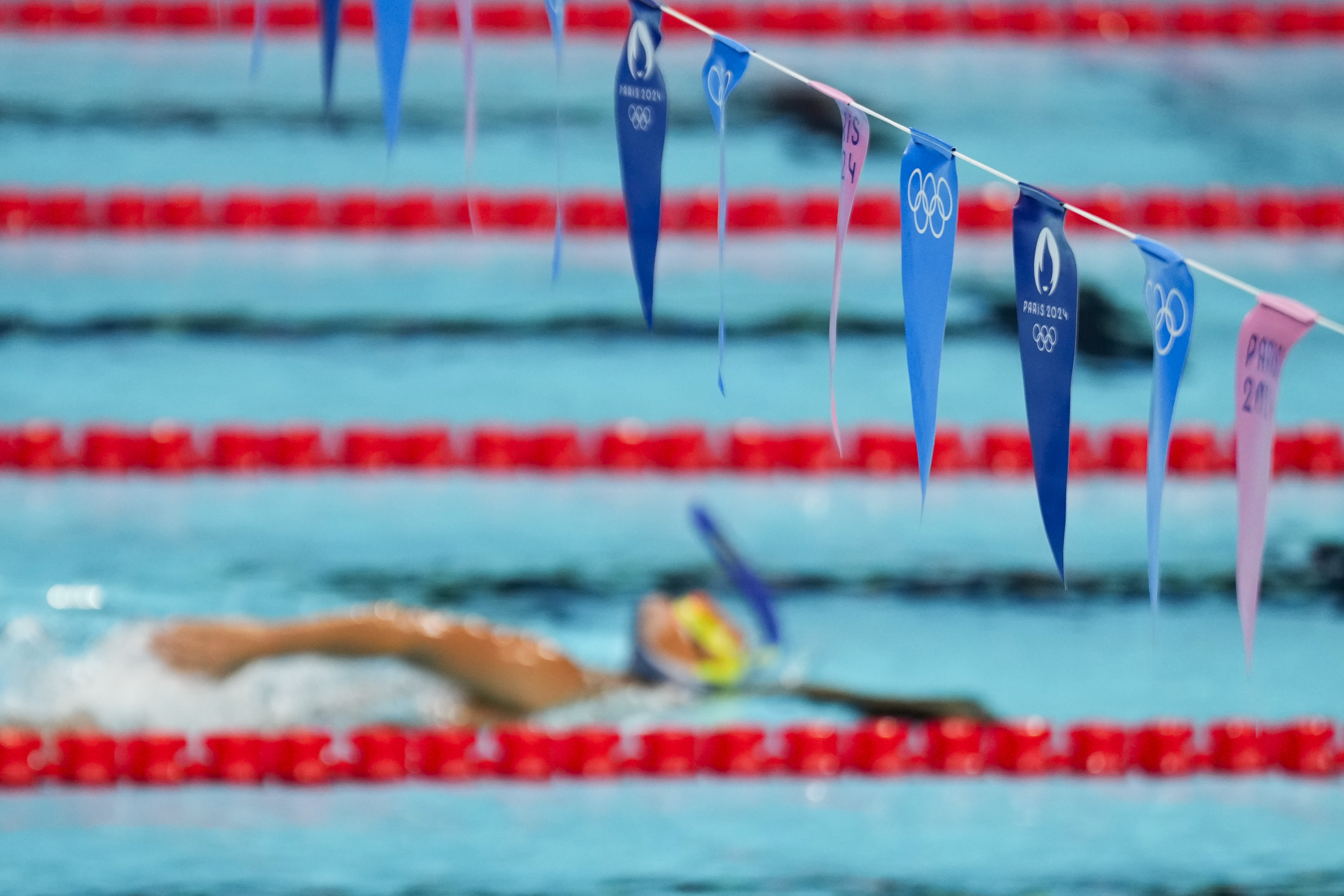 A swimmer trains at La Defense Arena ahead of the 2024 Summer Olympics, Wednesday, July 24, 2024, in Paris, France.