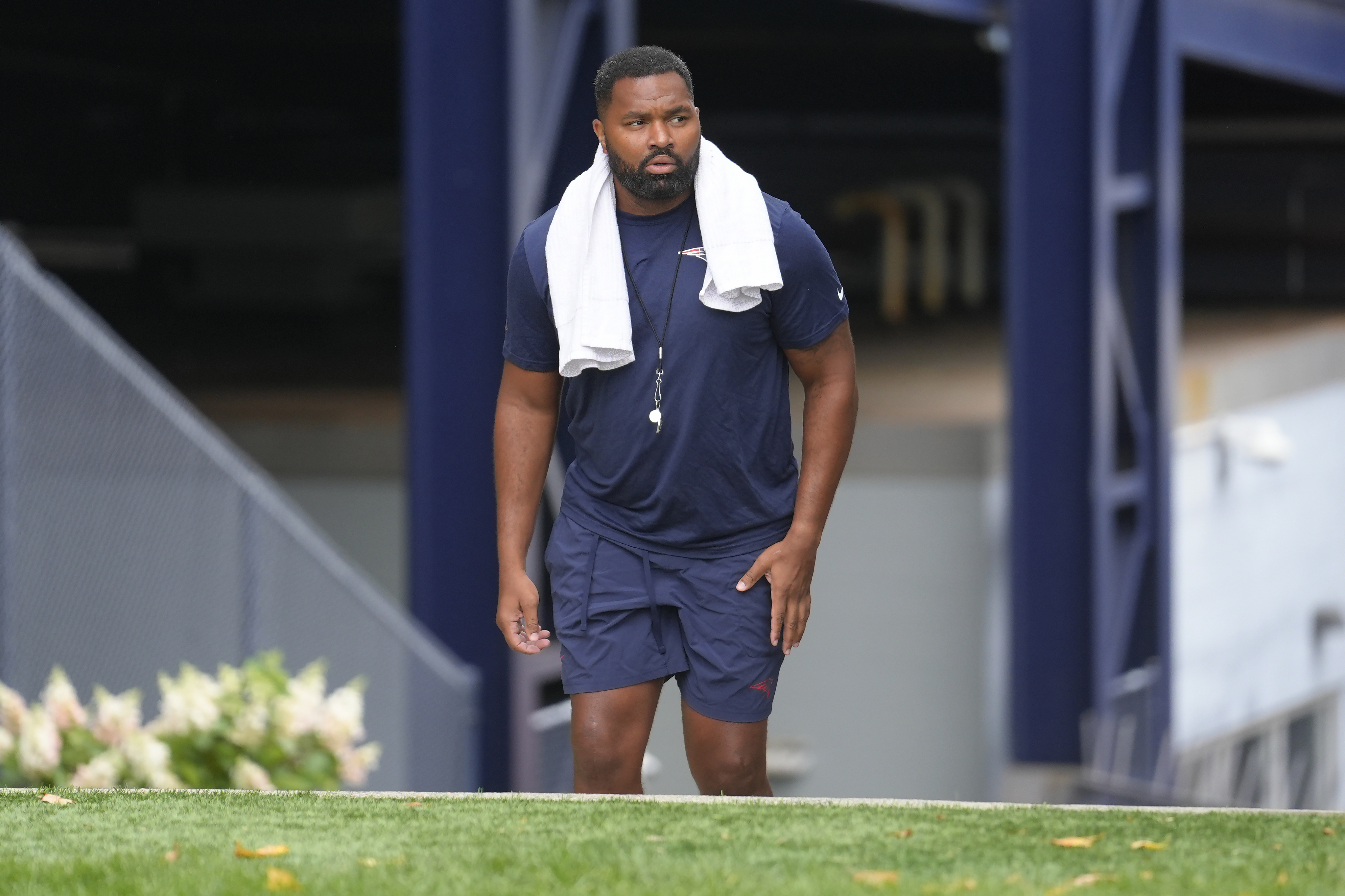 New England Patriots head coach Jerod Mayo steps on the field before an NFL football training camp, Wednesday, July 24, 2024, in Foxborough, Mass.
