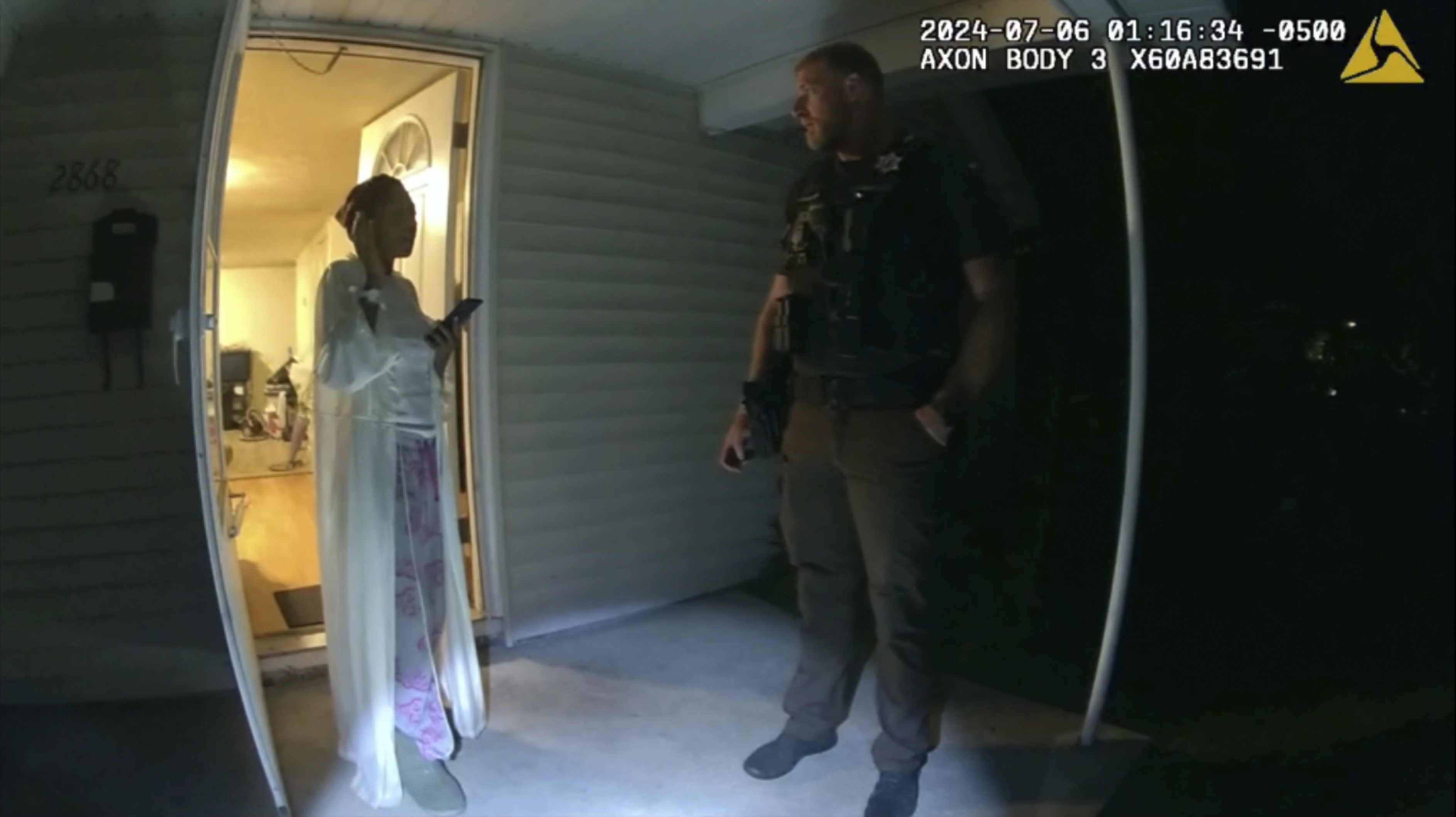 In this image taken from body camera video released by Illinois State Police, Sonya Massey, left, talks with former Sangamon County Sheriff’s Deputy Sean Grayson outside her home in Springfield, Ill., July 6. 