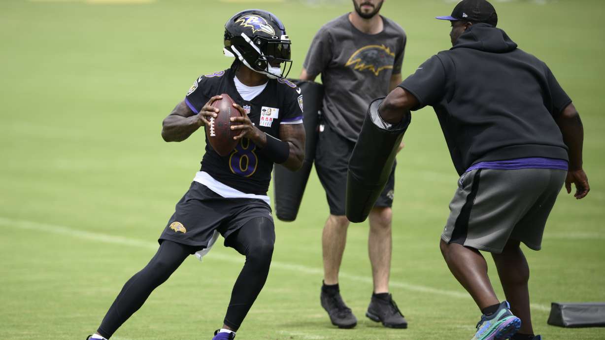 Baltimore Ravens quarterback Lamar Jackson runs a drill during NFL football training camp, Wednesday, July 24, 2024, in Owings Mills, Md.