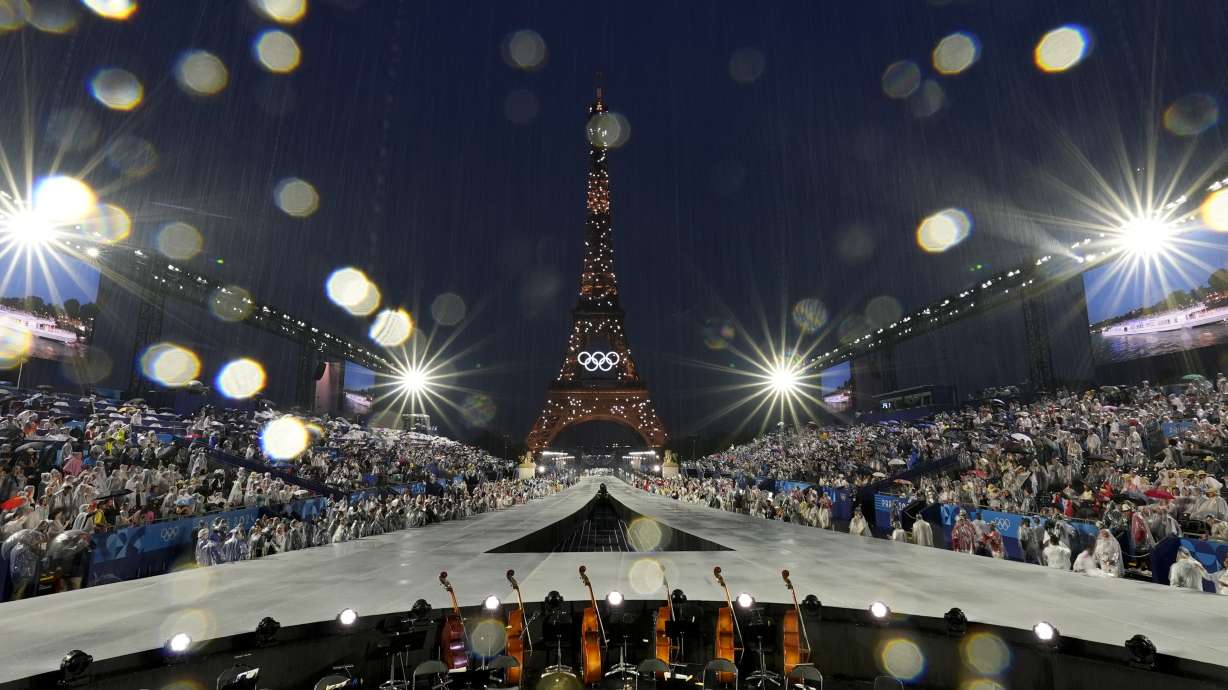 Rain pours down in Paris, France, during the opening ceremony of the 2024 Summer Olympics, Friday, July 26, 2024.