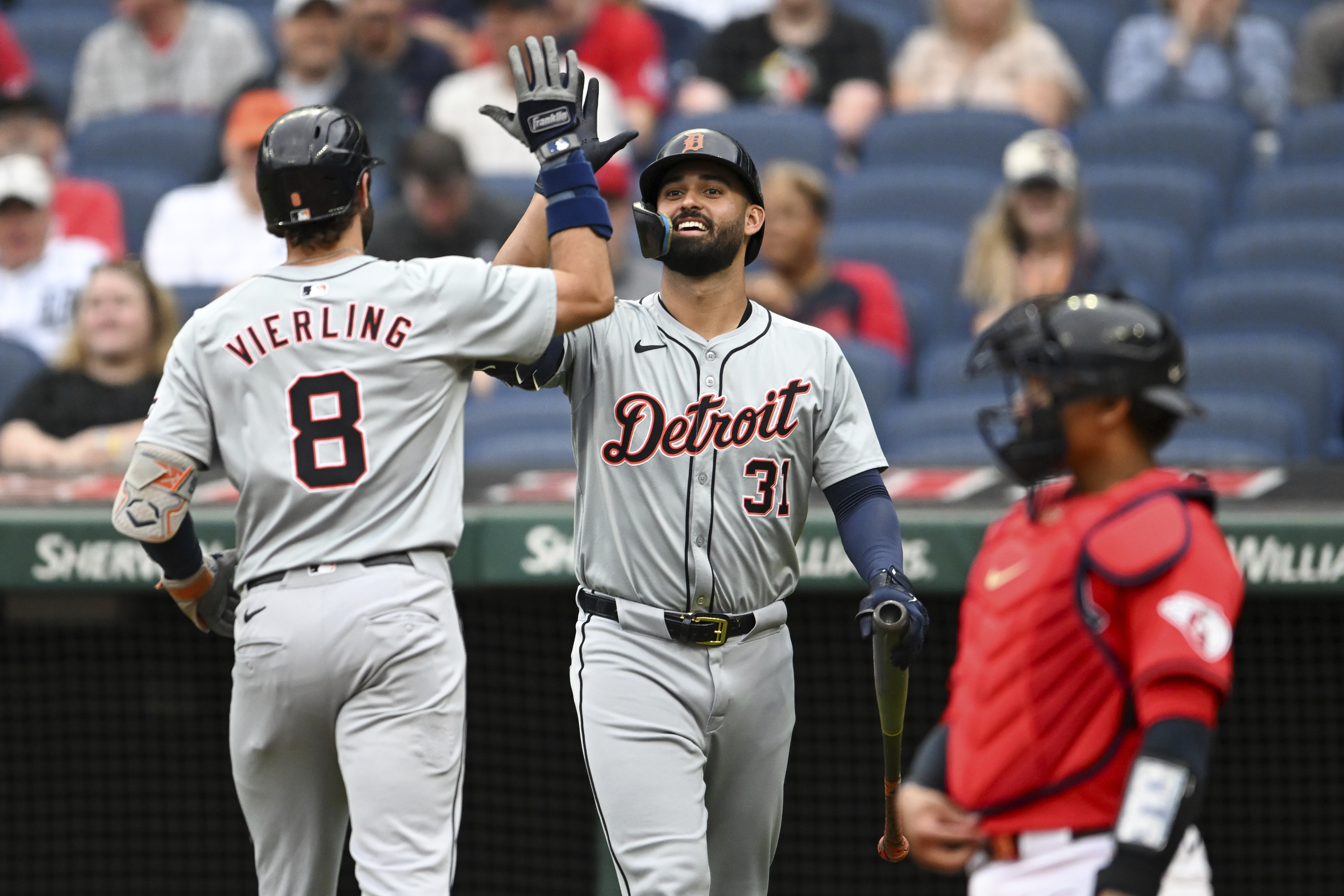 Detroit Tigers' Matt Vierling (8) and Riley Greene (31) celebrate a solo home run hit by Vierling during the first inning of a baseball game against the Cleveland Guardians, Wednesday, July 24, 2024, in Cleveland.
