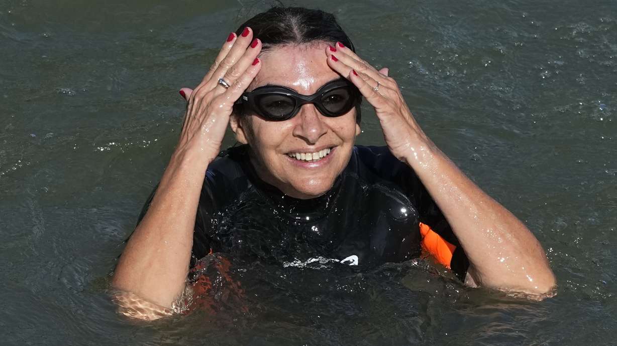 Paris Mayor Anne Hidalgo swims in the Seine river Wednesday, July 17, 2024 in Paris. After months of anticipation, Anne Hidalgo swam in the Seine Rive, fulfilling a promise she made in January nine days before the opening ceremony of the 2024 Olympics.