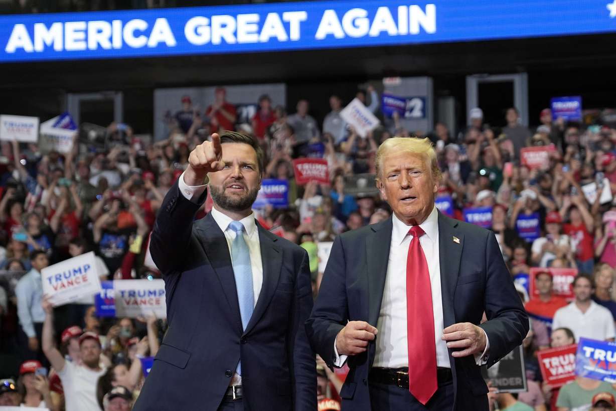 Republican presidential candidate former President Donald Trump and Republican vice presidential candidate Sen. JD Vance, R-Ohio, arrive at a campaign rally, July 20, in Grand Rapids, Mich.
