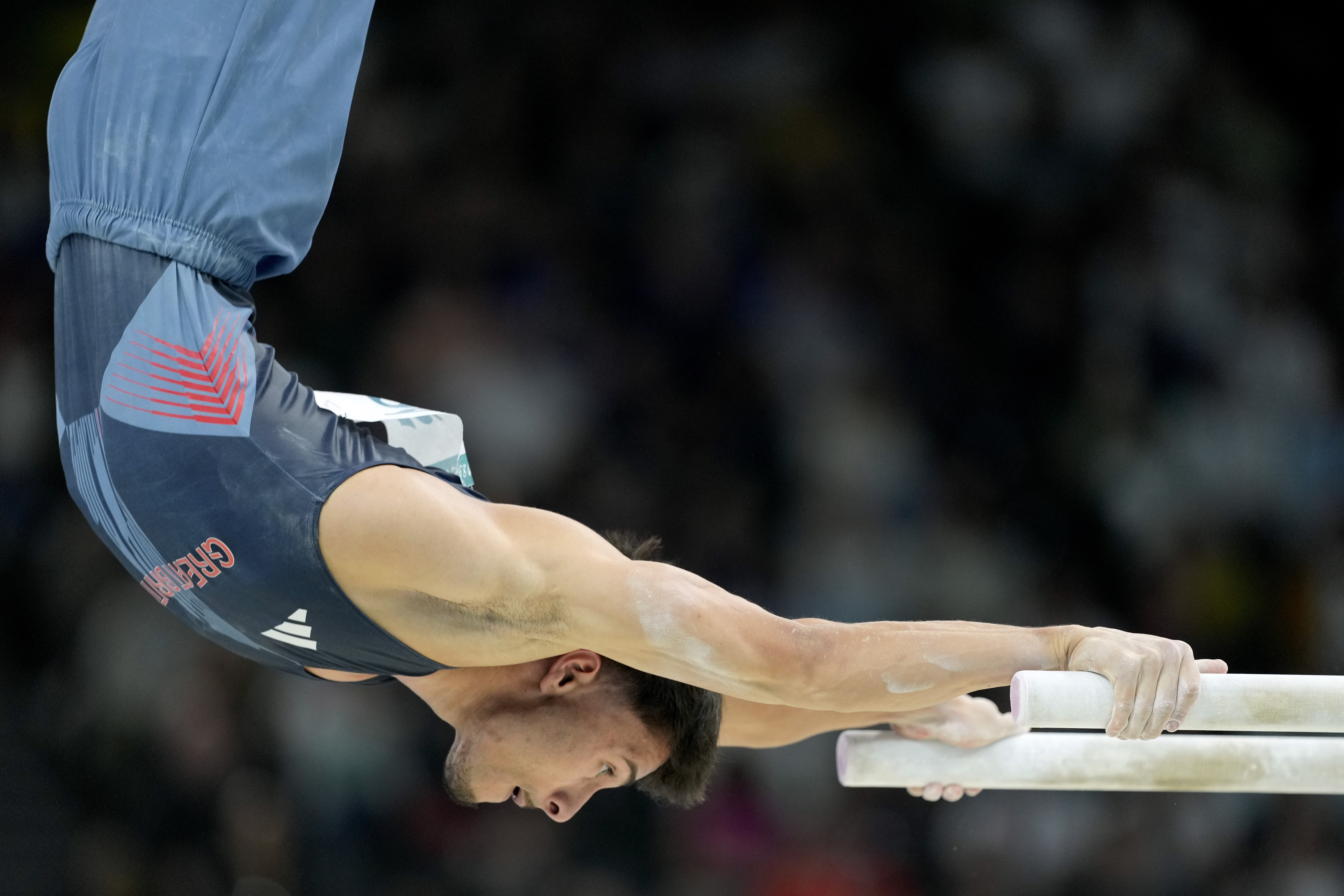 Jake Jarman, of Great Britain, competes on the parallel bars during a men's artistic gymnastics qualification round at the 2024 Summer Olympics, Saturday, July 27, 2024, in Paris, France. 