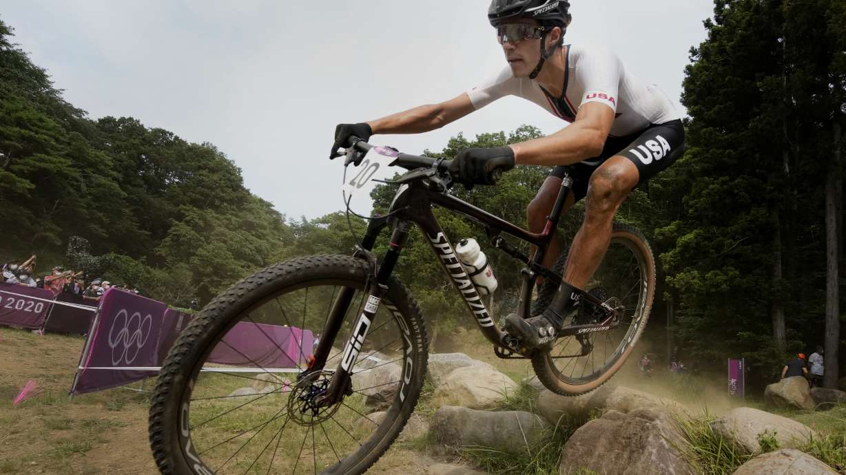 FILE - Christopher Blevins of the U.S. competes during the men's cross-country mountain bike competition at the 2020 Summer Olympics, July 26, 2021, in Izu, Japan.