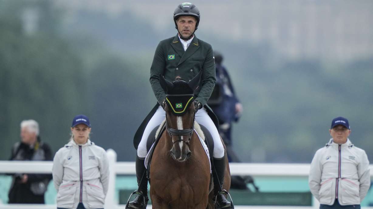 Brazil's Carlos Parros and his horse Safira during the Equestrian Eventing Dressage competition, at the 2024 Summer Olympics, Saturday, July 27, 2024, in Versailles, France.