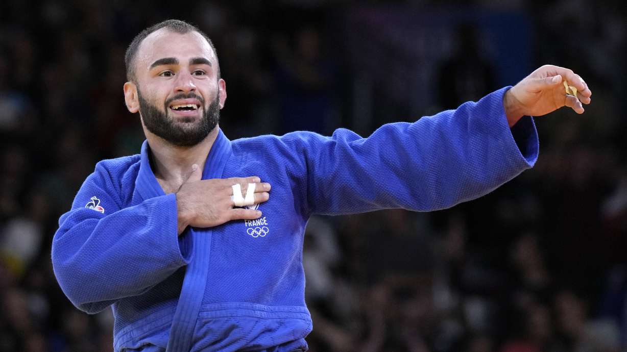 France's Luka Mkheidze celebrates after defeating Turkey's Salih Yildiz during their men -60 kg semifinal match in team judo competition at Champ-de-Mars Arena during the 2024 Summer Olympics, Saturday, July 27, 2024, in Paris, France.