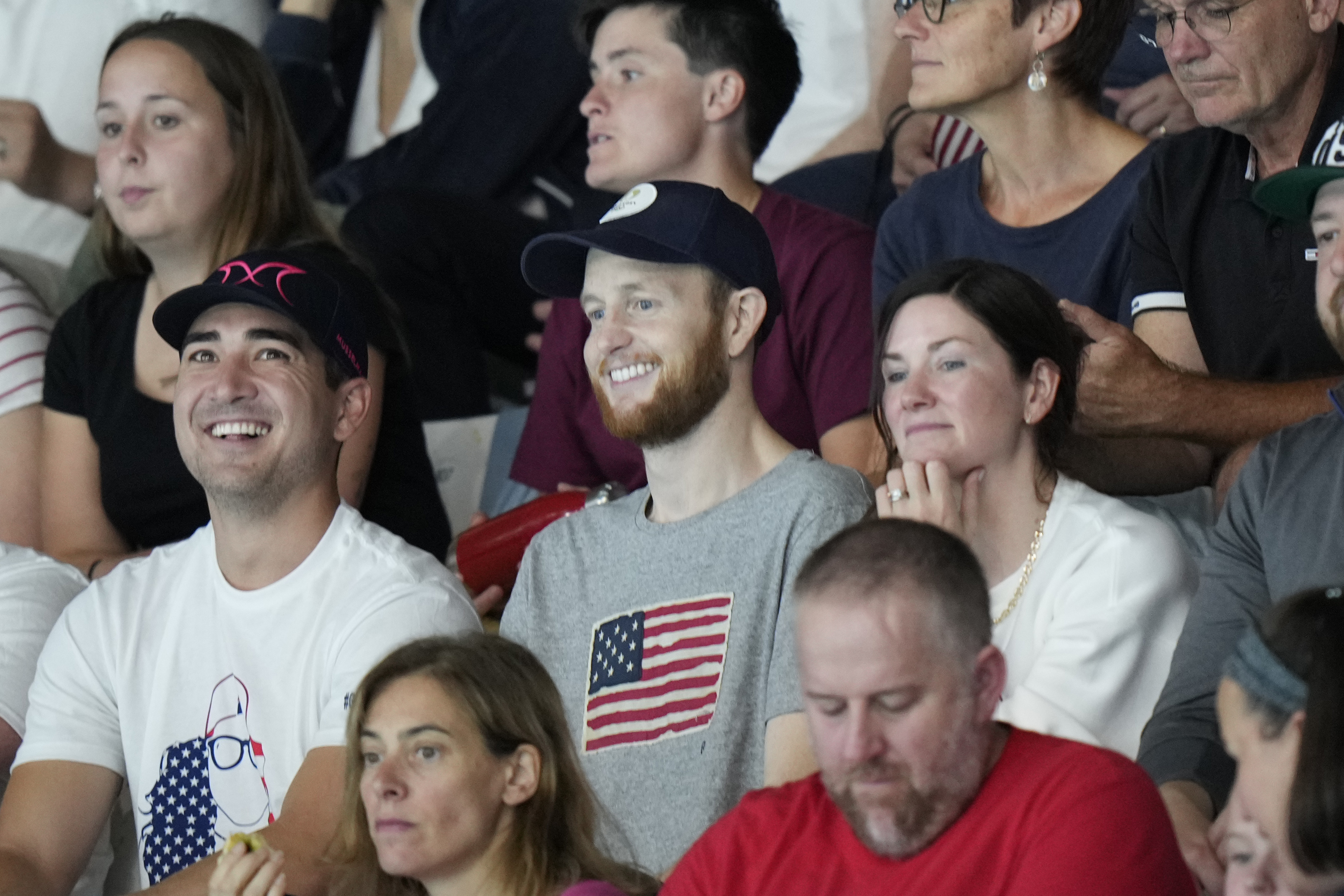 Pat Woepse, center, husband of the U.S. player Maddie Musselman, watches a match during a women's Water Polo Group B preliminary match between USA and Greece at the 2024 Summer Olympics, Saturday, July 27, 2024, in Saint-Denis, France. 