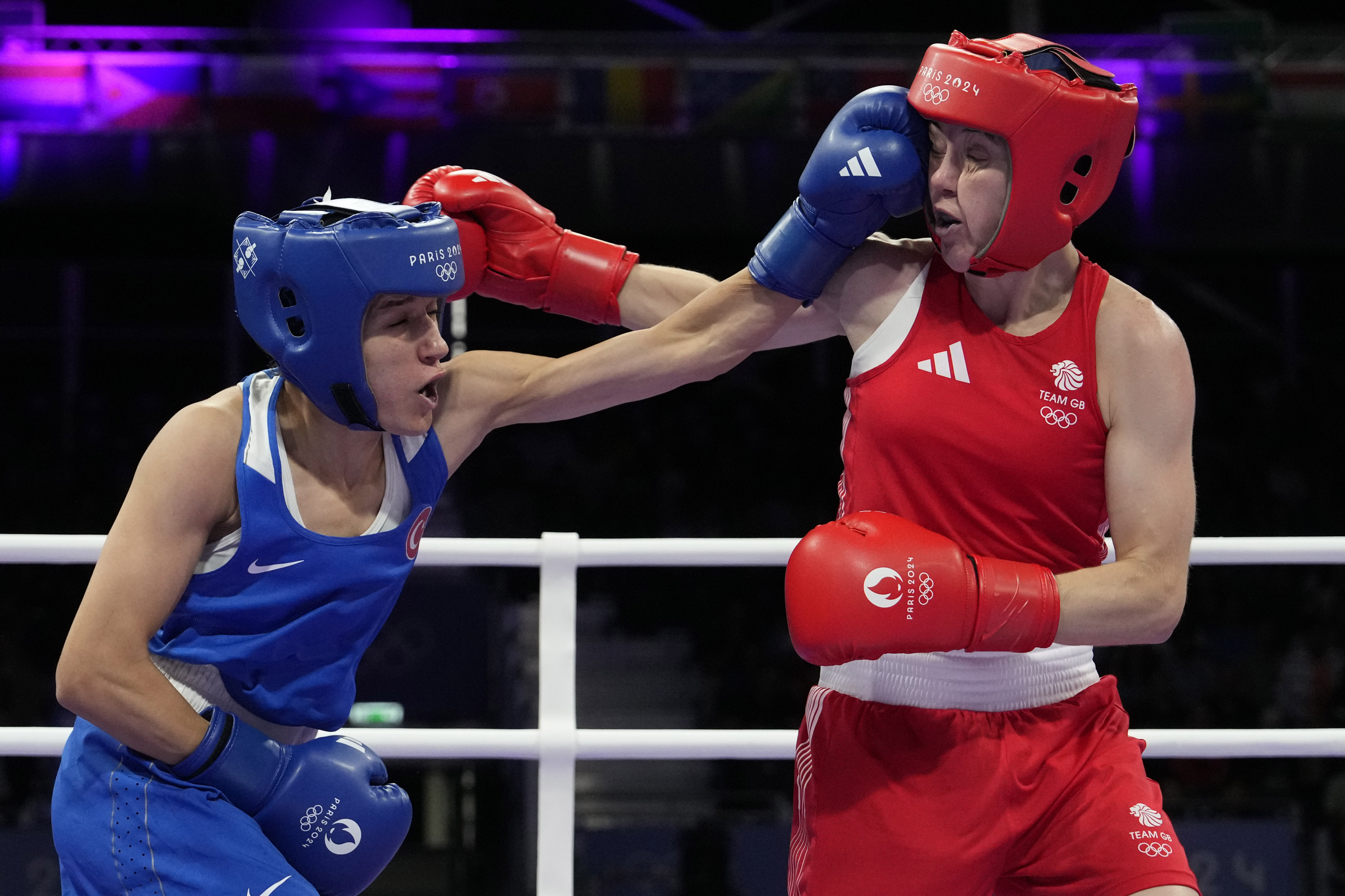 Turkey's Hatice Akbas lands a left to Britain's Charley Davison in their women's 54 kg preliminary boxing match at the 2024 Summer Olympics, Saturday, July 27, 2024, in Paris, France. 