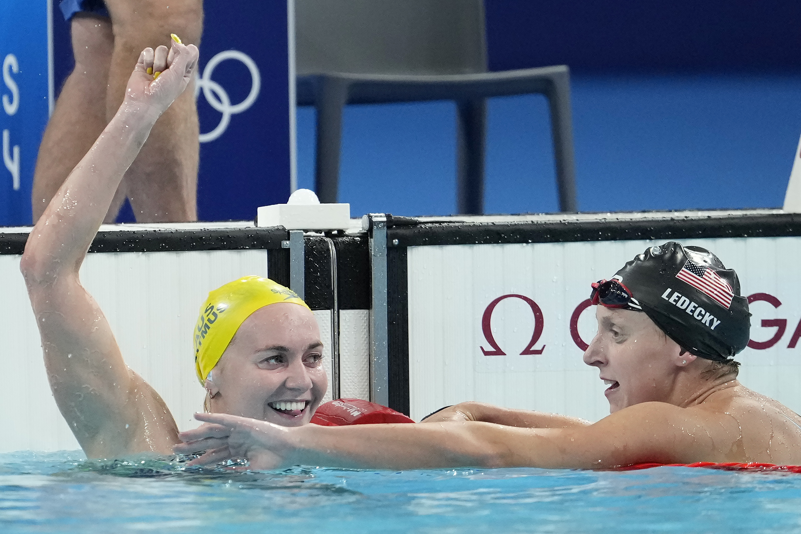 Ariarne Titmus, left, of Australia, celebrates after winning the women's 400-meter freestyle final as Katie Ledecky, of the United States, reacts at the 2024 Summer Olympics, Saturday, July 27, 2024, in Nanterre, France. 
