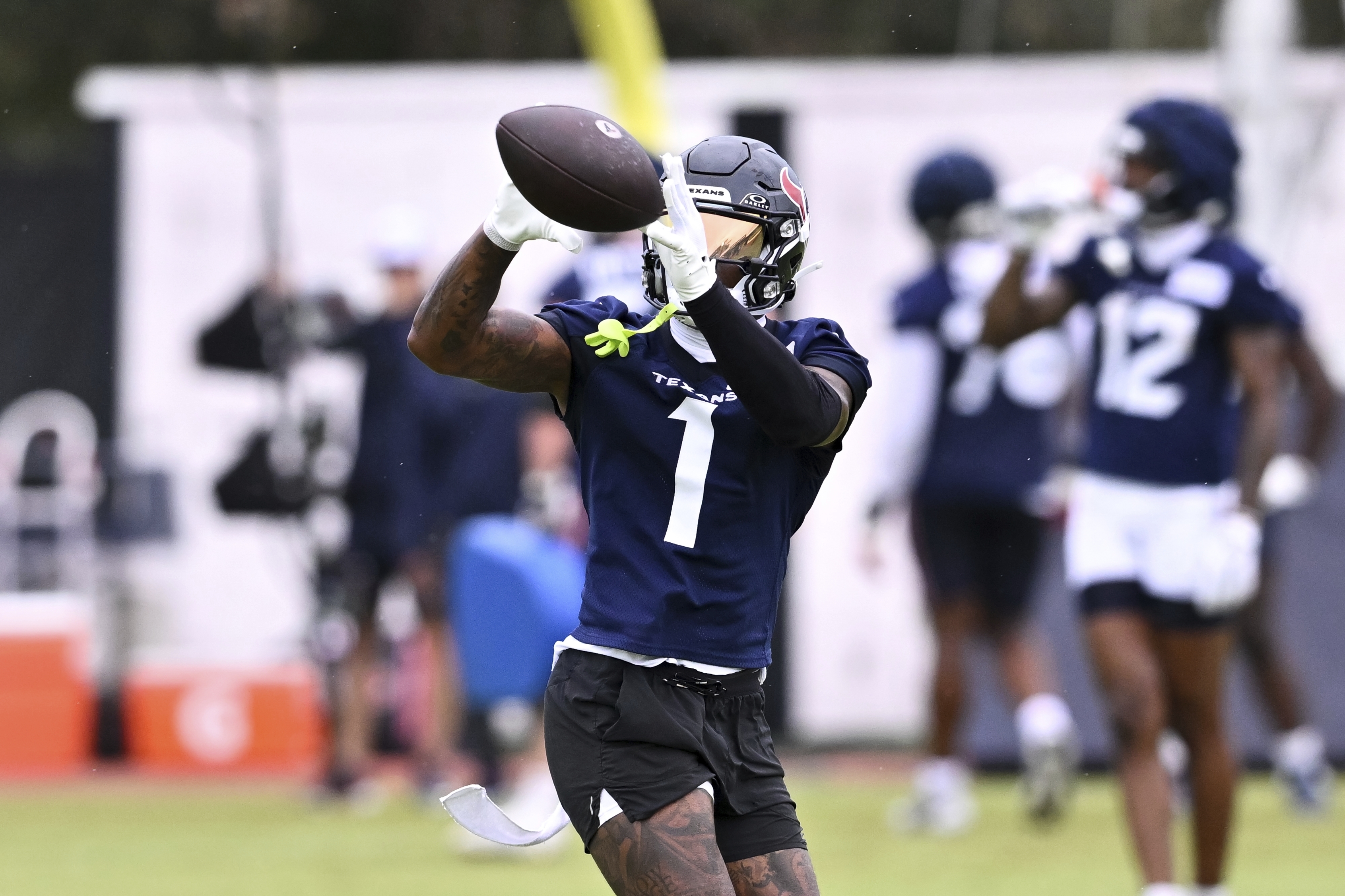 Houston Texans wide receiver Stefon Diggs (1) catches a pass during NFL football training camp, Thursday, July 18, 2024, Houston. 