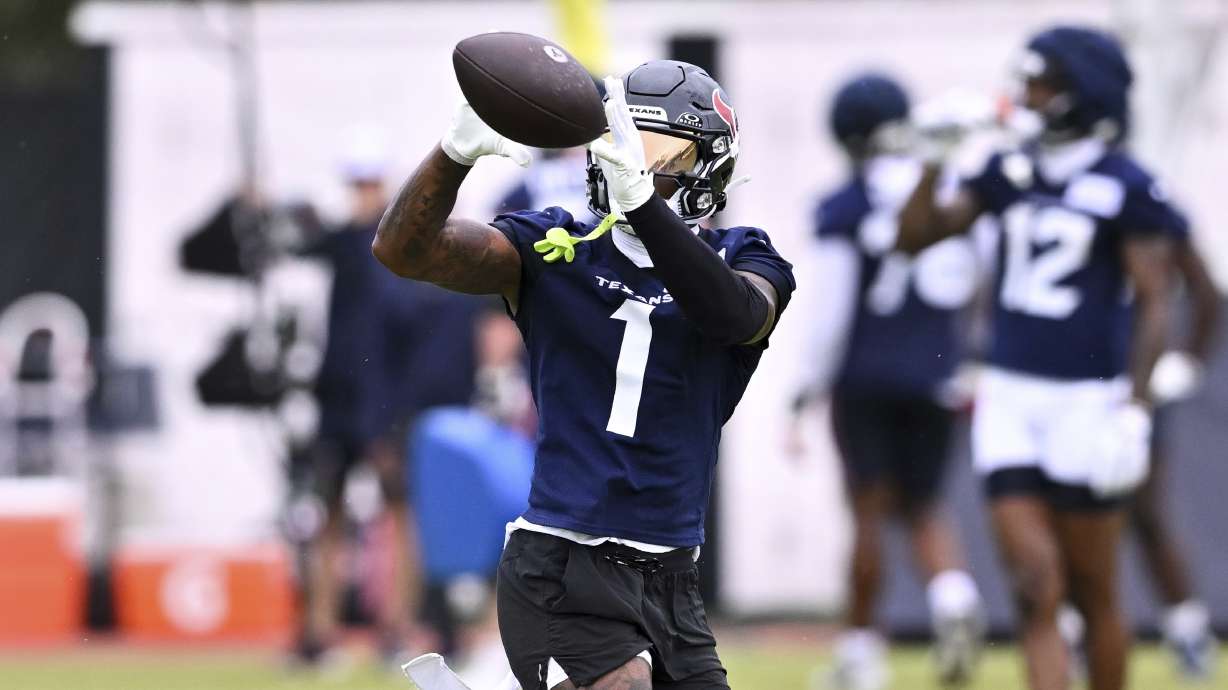 Houston Texans wide receiver Stefon Diggs (1) catches a pass during NFL football training camp, Thursday, July 18, 2024, Houston.