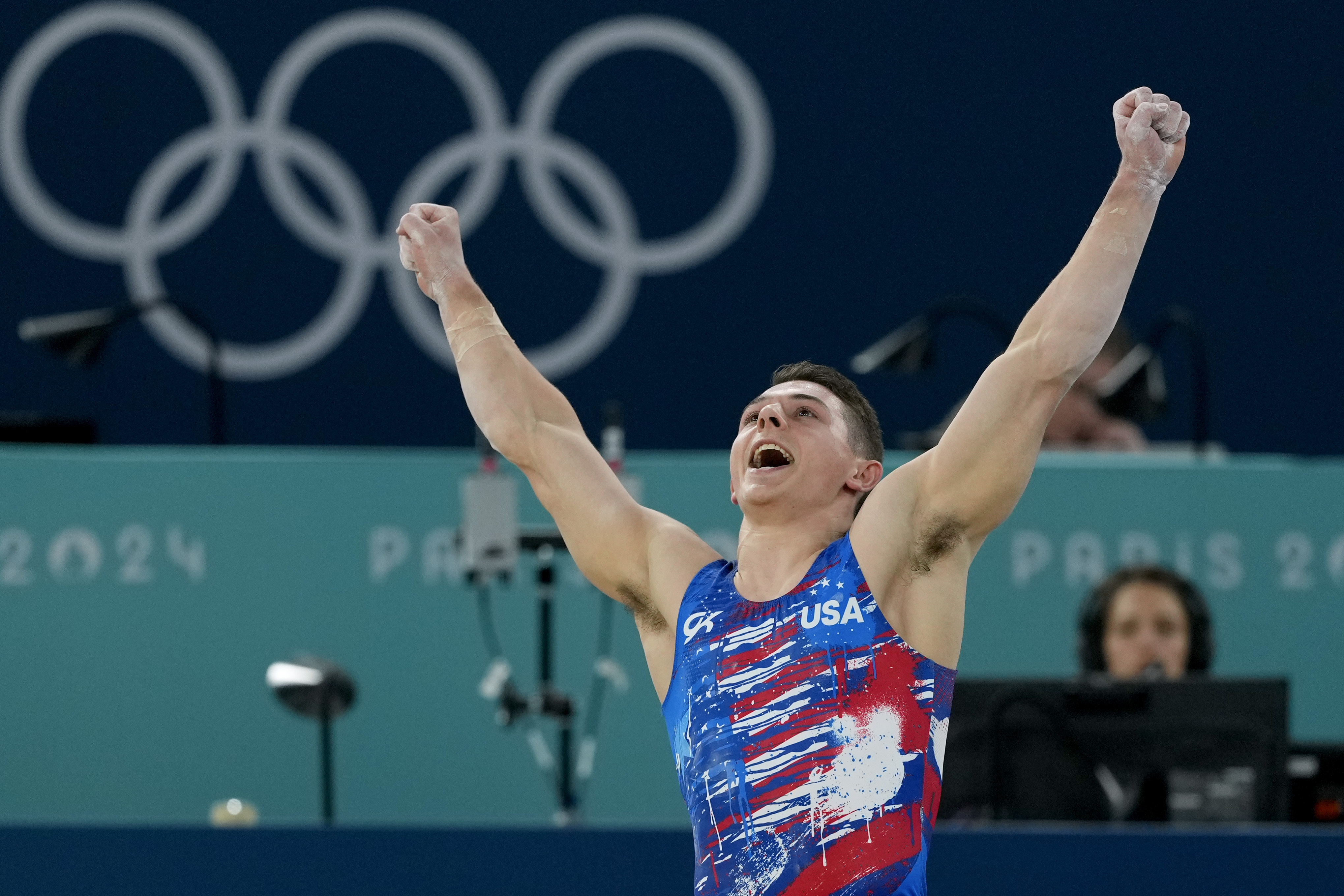 Paul Juda, of United States, celebrates after competing on the floor exercise during a men's artistic gymnastics qualification round at the 2024 Summer Olympics, Saturday, July 27, 2024, in Paris, France. 
