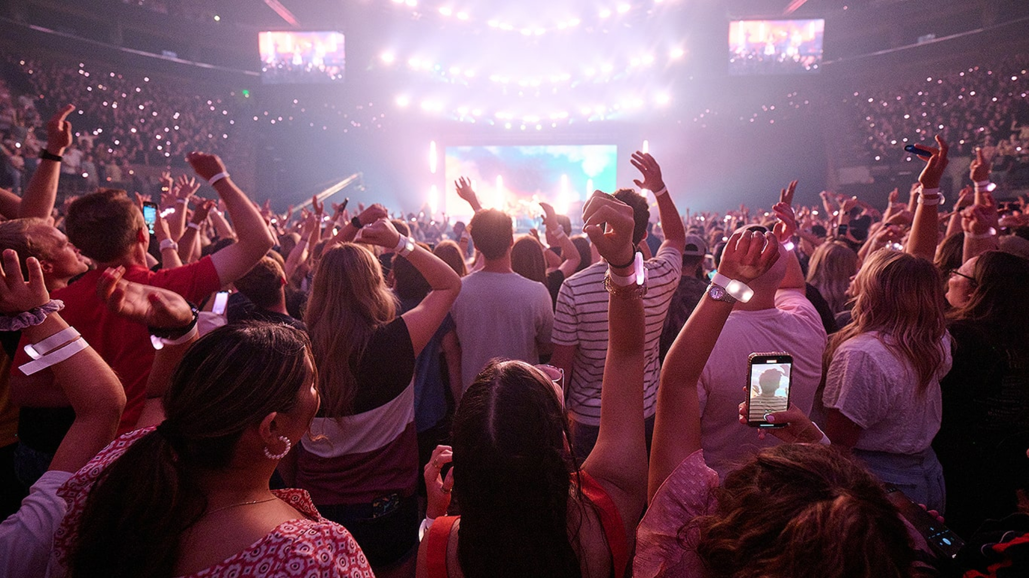 Attendees at a concert during the 2023 Utah Area YSA Conference of at the Salt Palace on Aug. 5, 2023. The 2024 conference is happening Aug. 2-4