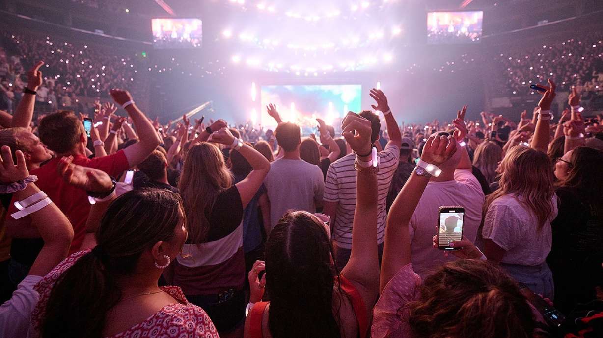 Attendees at a concert during the 2023 Utah Area YSA Conference of at the Salt Palace on Aug. 5, 2023. The 2024 conference is happening Aug. 2-4