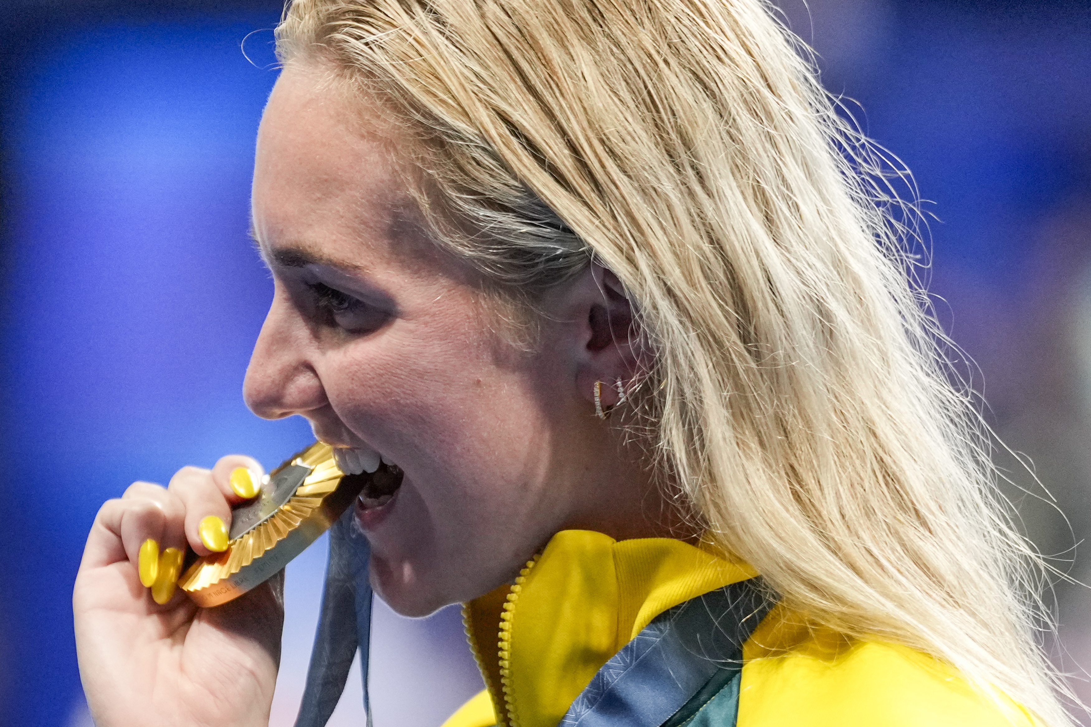 Gold medalist, Ariarne Titmus, of Australia, poses for the media after winning the women's 400-meter freestyle final at the 2024 Summer Olympics, Saturday, July 27, 2024, in Nanterre, France. 