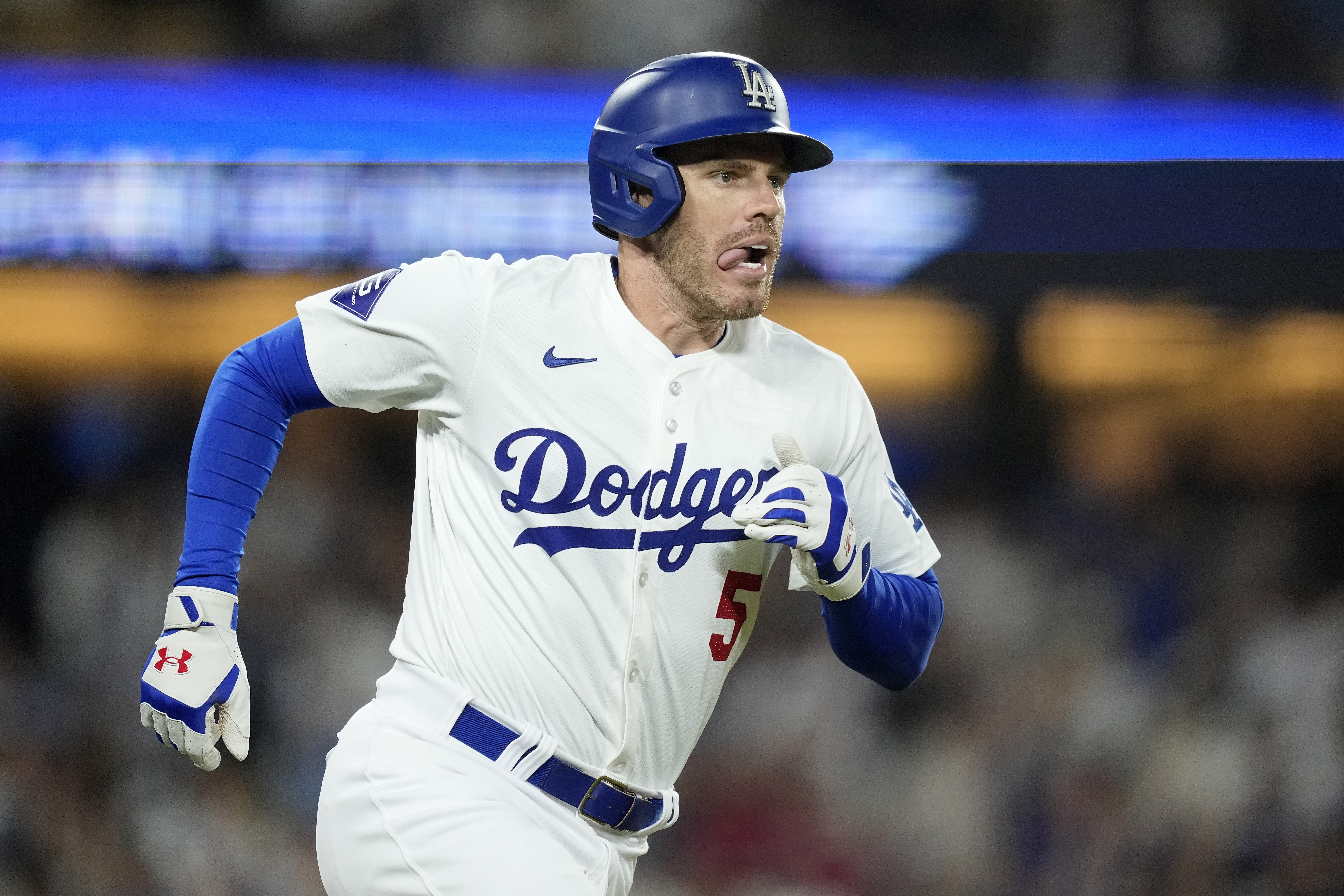 Los Angeles Dodgers' Freddie Freeman heads to first after hitting a grand slam during the eighth inning of a baseball game against the Boston Red Sox Friday, July 19, 2024, in Los Angeles.