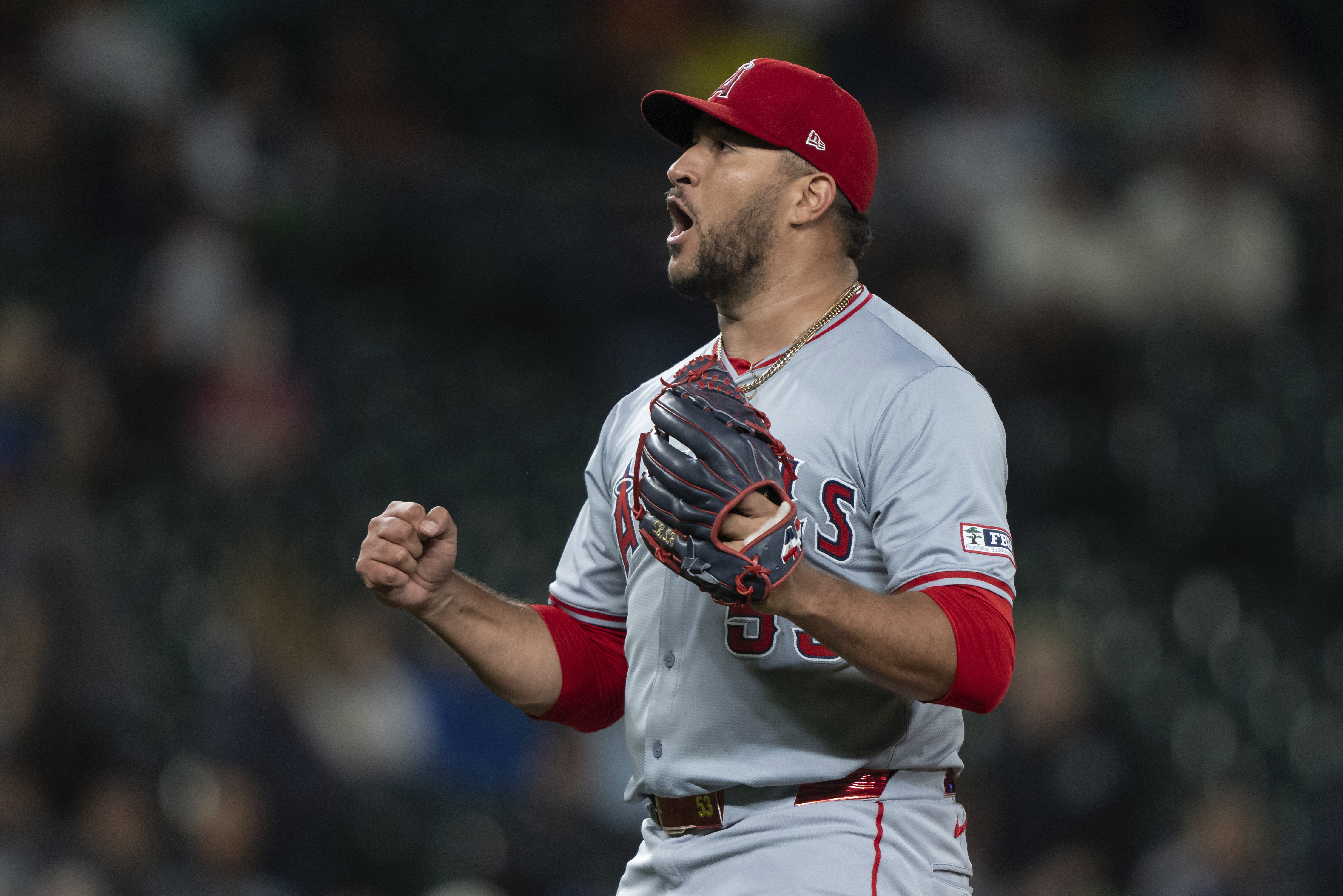 Los Angeles Angels relief pitcher Carlos Estevez celebrates after a baseball game against the Seattle Mariners, Monday, July 22, 2024, in Seattle. 
