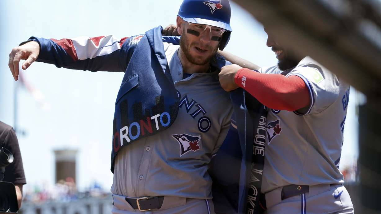 Toronto Blue Jays' Danny Jansen, left, celebrates with Vladimir Guerrero Jr., right, after hitting a solo home run against the San Francisco Giants during the first inning of a baseball game Thursday, July 11, 2024, in San Francisco.