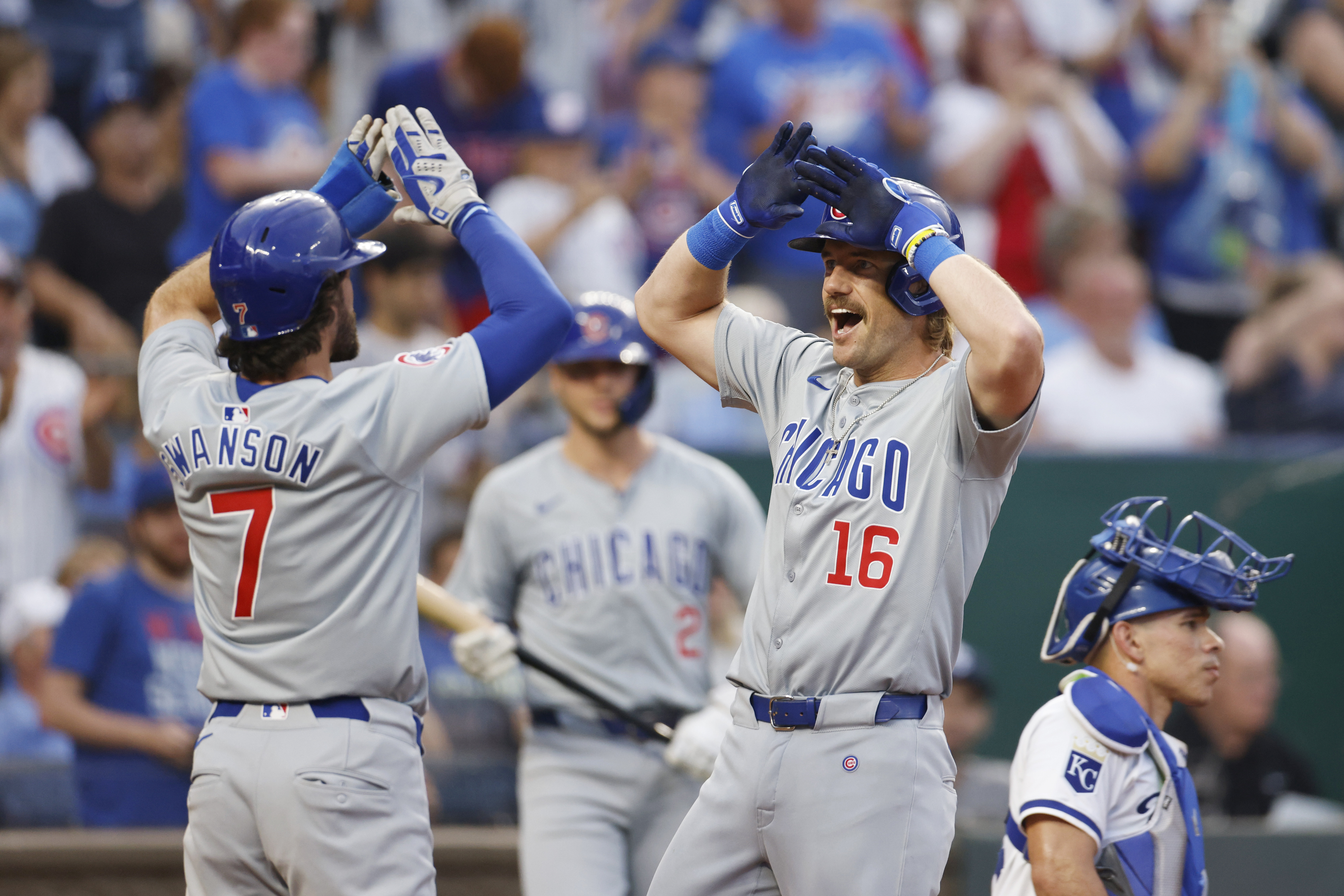 Chicago Cubs' Patrick Wisdom (16) celebrates hitting a grand slam with Dansby Swanson (7) during the seventh inning of a baseball game against the Kansas City Royals in Kansas City, Mo., Saturday, July 27, 2024.