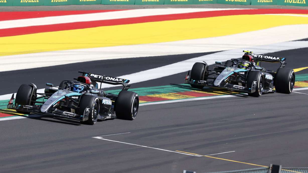 Mercedes driver George Russell of Britain, left, leads ahead of Mercedes driver Lewis Hamilton of Britain as they steer their cars during the Formula One Grand Prix at the Spa-Francorchamps racetrack in Spa, Belgium, Sunday, July 28, 2024.