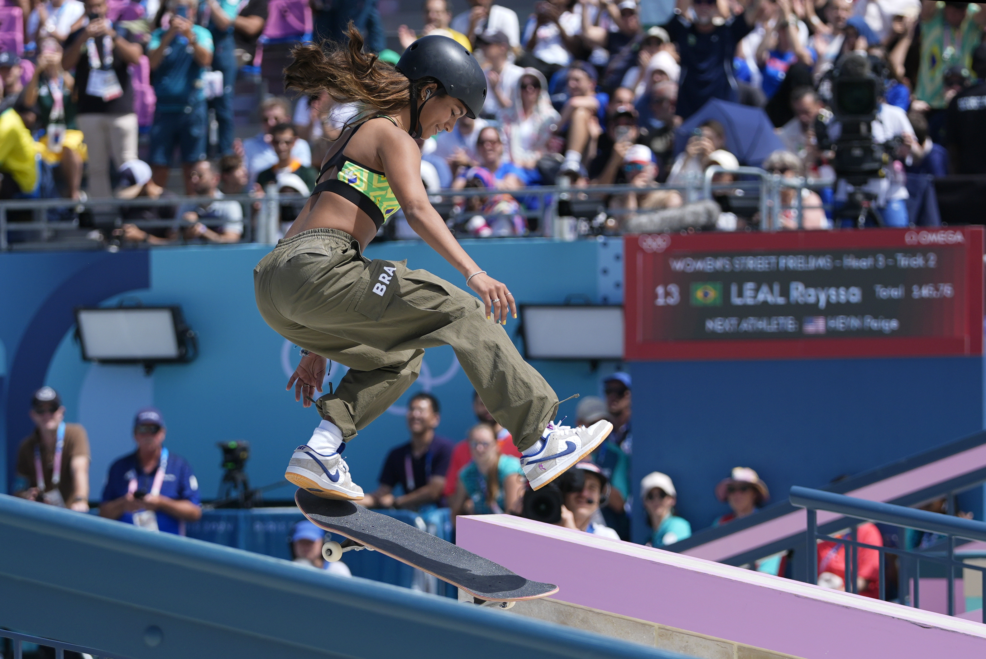 Rayssa Leal, of Brazil, performs a trick during the women's skateboard street preliminaries at the 2024 Summer Olympics, Sunday, July 28, 2024, in Paris, France. 