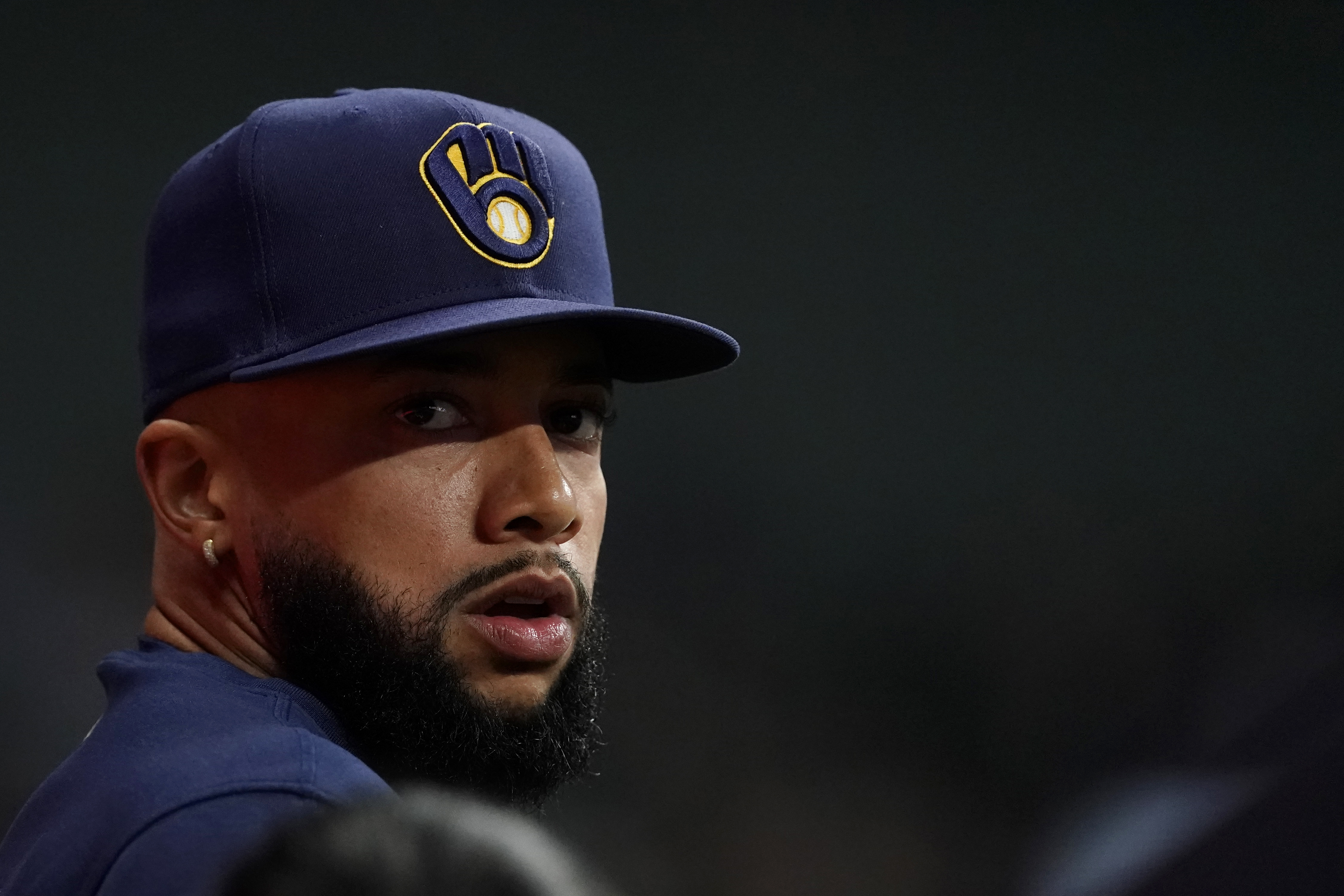 FILE - Milwaukee Brewers' Devin Williams watches from the dugout during the seventh inning of a baseball game against the Pittsburgh Pirates Wednesday, July 10, 2024, in Milwaukee. Williams appears on the verge of making his season debut after missing four months with stress fractures in his back. 