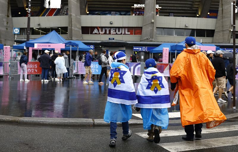 Fans outside the Paris 2024 Olympics Israel vs. Paraguay game, Paris, Saturday. French police have opened an investigation into death threats against three Israeli athletes at the Olympic Games, the Paris prosecutors' office said.