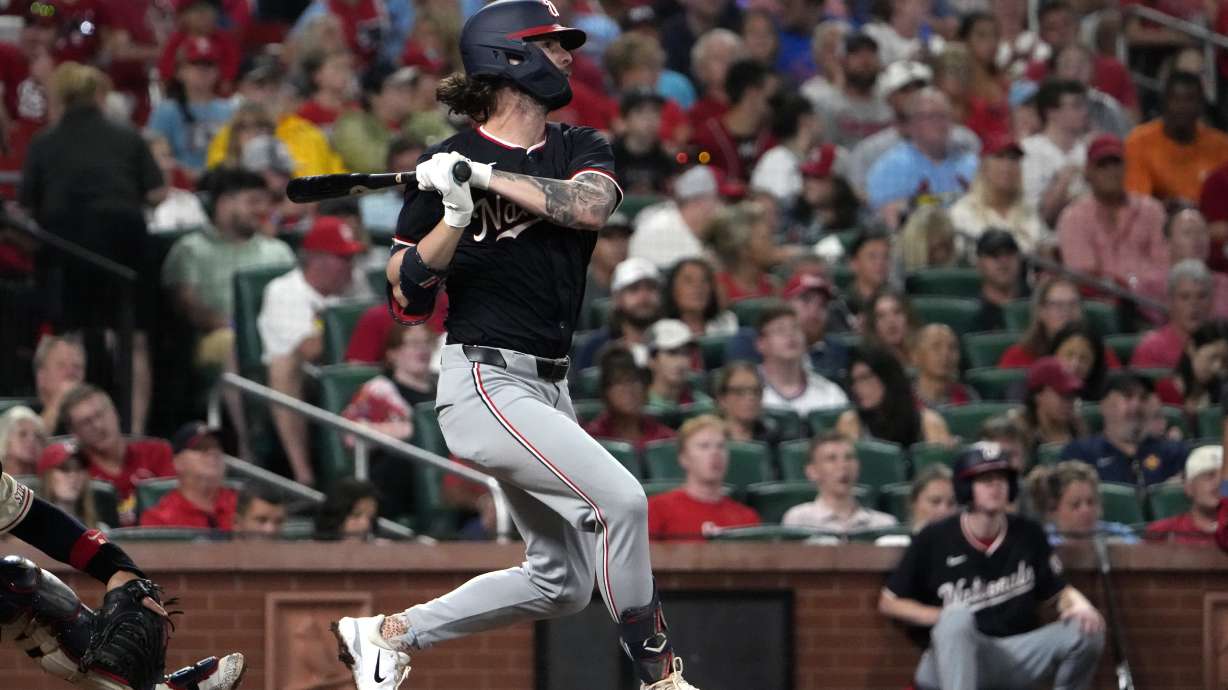 Washington Nationals' Jesse Winker hits an RBI single during the third inning of a baseball game against the St. Louis Cardinals Saturday, July 27, 2024, in St. Louis.