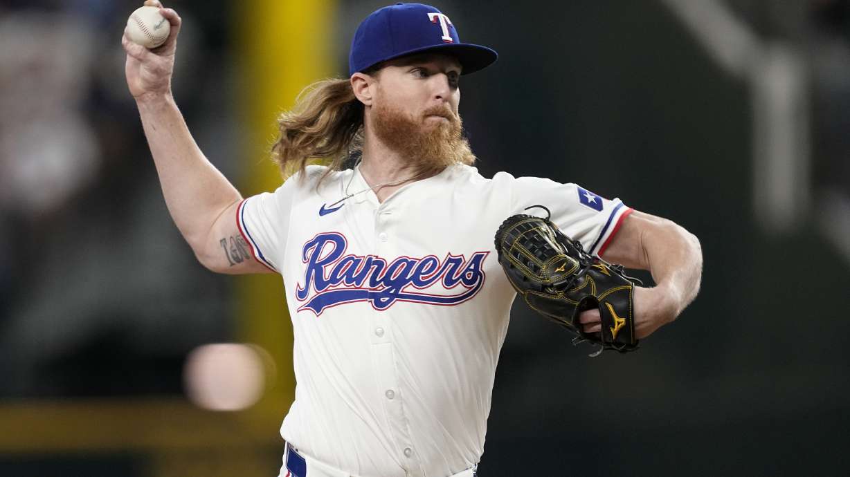 Texas Rangers starting pitcher Jon Gray throws to the Chicago White Sox in the first inning of a baseball game, Tuesday, July 23, 2024, in Arlington, Texas.