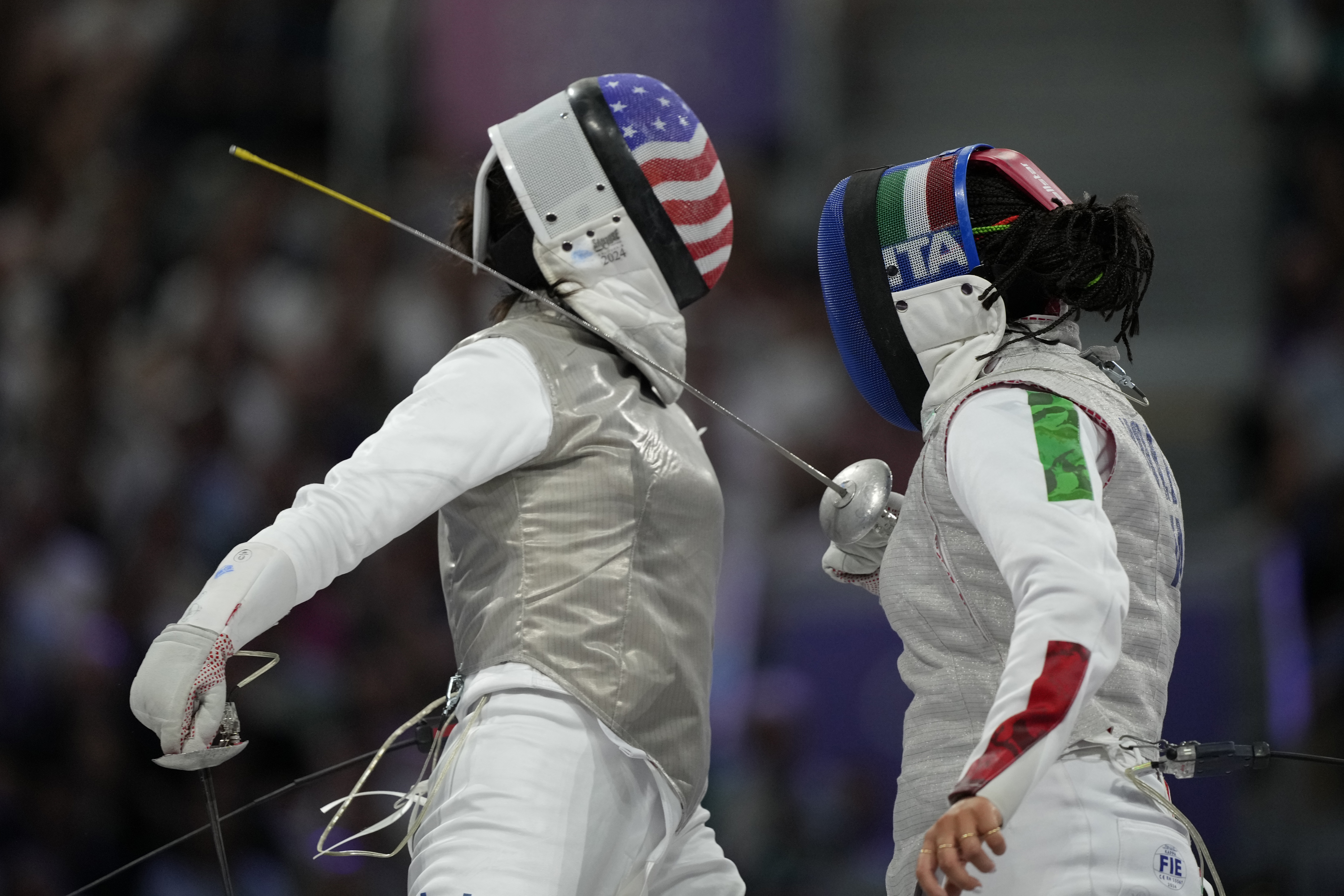 United States' Lee Kiefer, left, competes with Italy's Alice Volpi in the women's individual Foil semifinal match during the 2024 Summer Olympics at the Grand Palais, Sunday, July 28, 2024, in Paris, France.