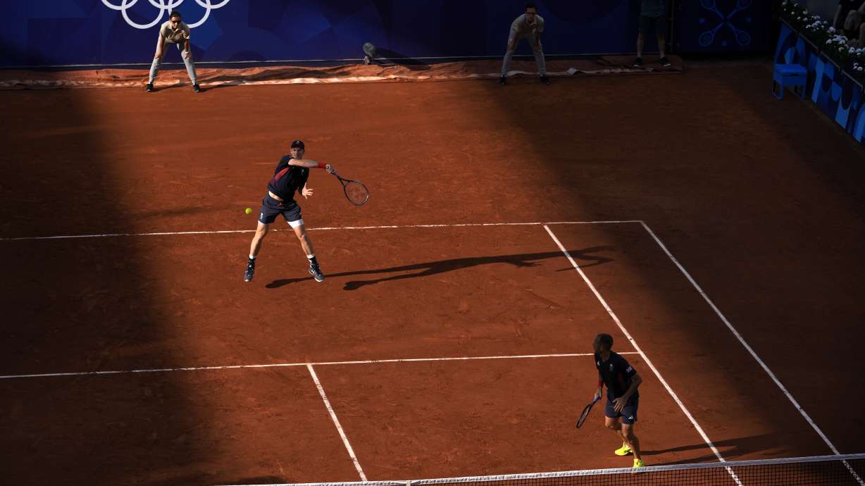 Andy Murray and Daniel Evans of Britain play against Kei Nishikori and Toro Daniel of Japan during the men's doubles tennis competition, at the 2024 Summer Olympics, Sunday, July 28, 2024, in Paris, France.