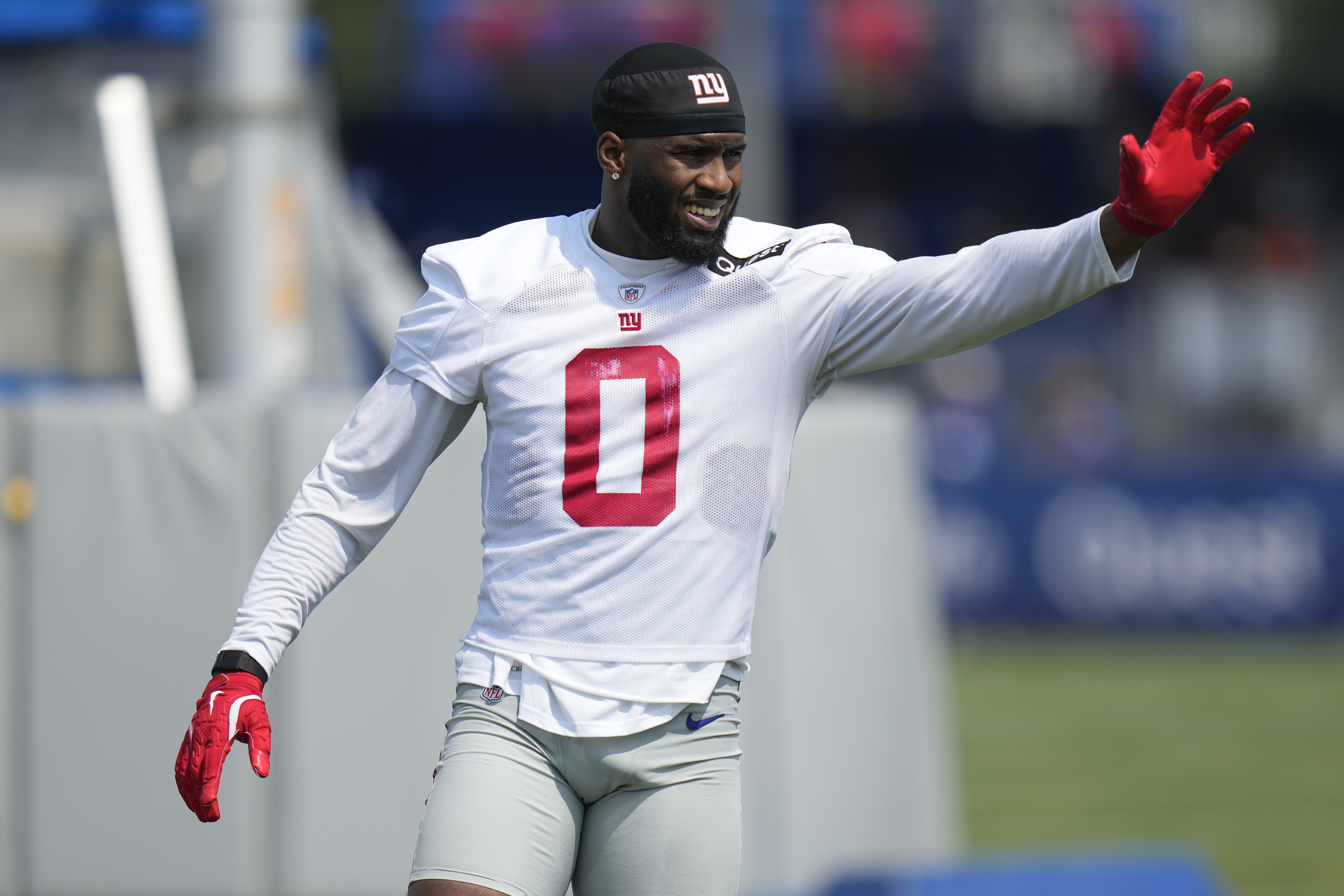 New York Giants' Brian Burns participates in a drill during the NFL football team's training camp in East Rutherford, N.J., Sunday, July 28, 2024. 