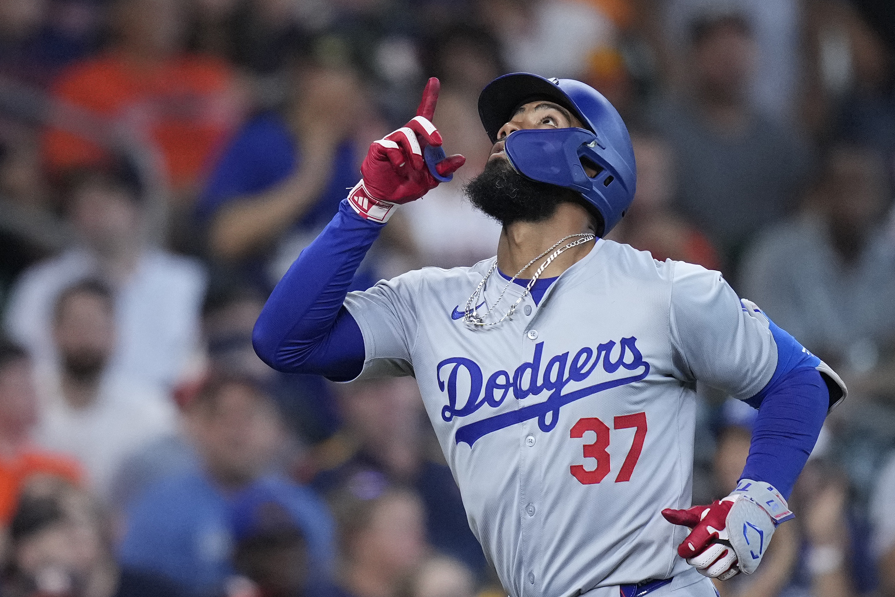 Los Angeles Dodgers' Teoscar Hernández runs the bases after hitting a solo home run during the eighth inning of a baseball game against the Houston Astros, Sunday, July 28, 2024, in Houston. 