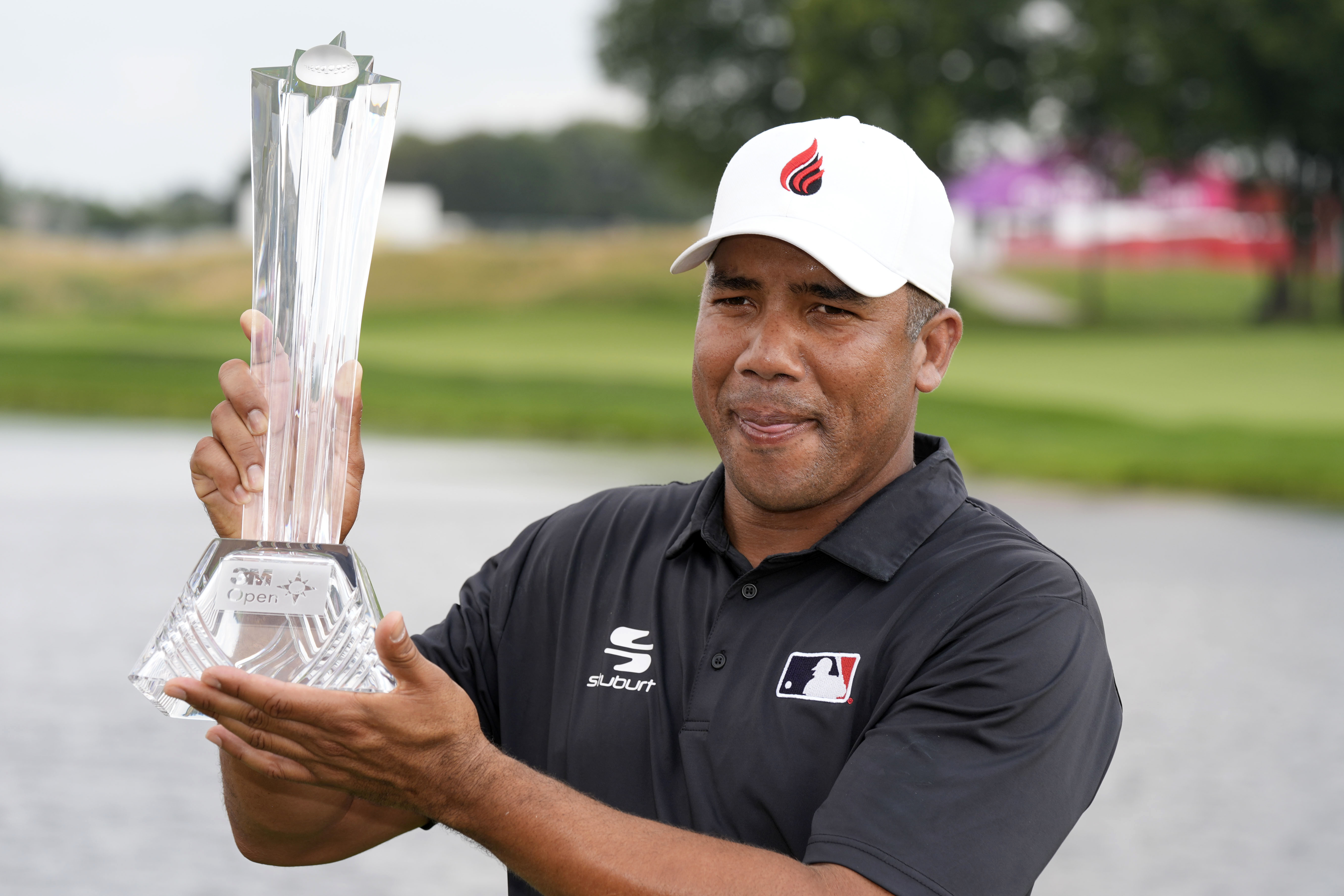 Jhonattan Vegas holds the trophy after winning the 3M Open golf tournament at the Tournament Players Club, Sunday, July 28, 2024, in Blaine, Minn. 